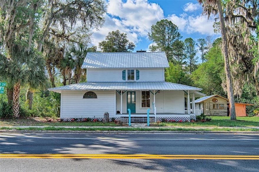 Step back in time while enjoying modern possibilities with this beautifully preserved historic home, originally built in 1885 by Henry Baldwin of Naugatuck, Connecticut. Nestled in the heart of picturesque Melrose, Florida, this two-story residence offers a rare blend of heritage, charm, and versatility.Featuring 4  bedrooms and 2.5 bathrooms, the home boasts classic architectural details and inviting living spaces filled with warmth and character. Relax and unwind on the  front or back porches, perfect for enjoying Florida’s tranquil surroundings, morning coffee, or evening gatherings.The property also includes a quaint metal-roofed workshop, brimming with potential—easily convertible into a charming guest cottage, studio, or creative retreat. There is also another small out building perfect for storage.Adding to its appeal, the property is zoned for home-based business use, offering a unique opportunity. Operate your business right from home, with the convenience of on-site work permitted as long as the owner resides on the property. Melrose is a small town with lots of charm. Boasting only one traffic light but twice as many art galleries and several lakes available for swimming, boating and other water activities. Melrose is also located 20 minutes from the city of Gainesville, home of the University of Florida and all that comes with a college town. Whether you're seeking a distinctive residence, a live/work opportunity, or a piece of Florida history, this property offers endless possibilities.