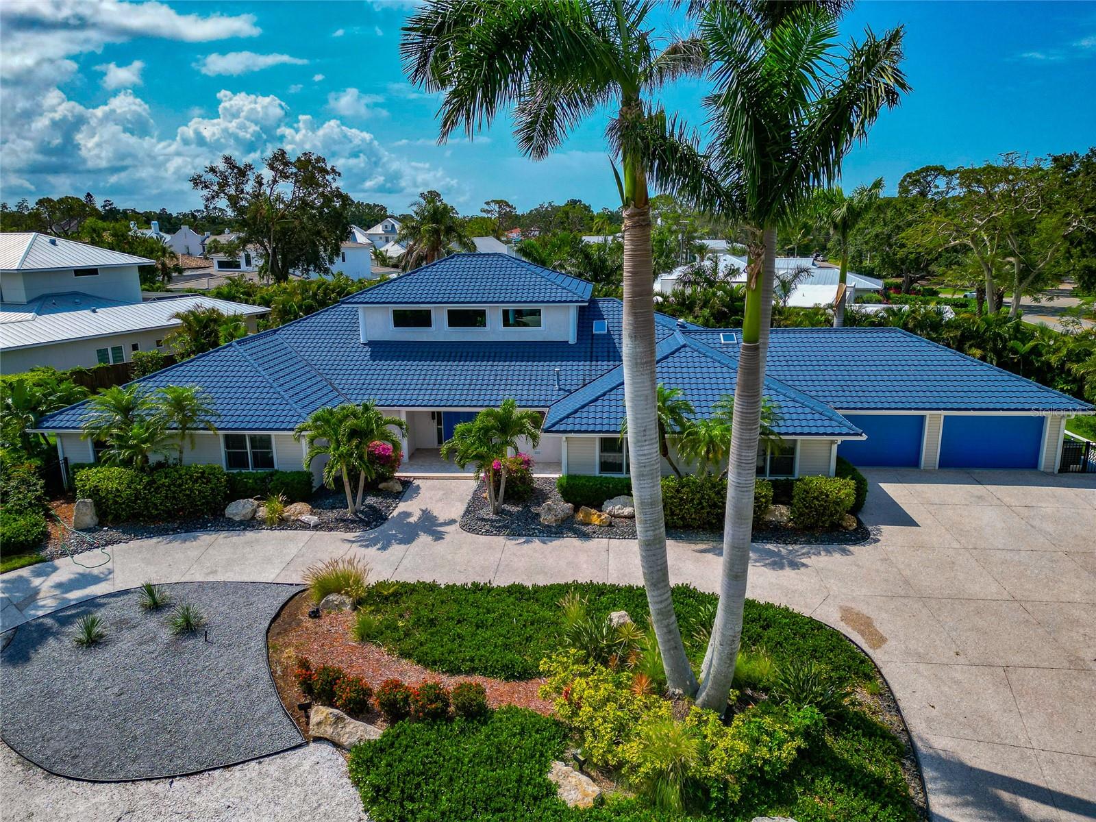 TOTALLY UPDATED & ALL NEW FULLY FURNISHED (2024), NOT IMPACTED BY STORMS- SPACIOUS ELEGANCE, BEST BEACHES, ARTS, SHOPPING & FINE DINING, OVERSIZED CORNER LOT, CHEF’S KITCHEN. You will love where you live!! and treasure each moment in this Tropical Paradise surrounded by mature plush landscaping, a home inspired by the colors, and beauty of Florida’s Gulf Coast and the glamour of one of the most sought-after Sarasota neighborhoods. Enjoy life in a peaceful atmosphere located within walking distance of Roberts Bay and the historic Field Club, minutes’ drive to Sarasota’s cultural center, with gorgeous sugar-sand beaches that include three of Florida’s most beloved and famous Gulf beaches: Siesta Key, Lido Key, and Longboat Key. Shop and dine at St Armands on Lido Key, enjoy the arts, shopping, and fine dining at Sarasota’s Main Street and Downtown, providing the utmost convenience, a vibrant lifestyle. It's rare opportunity to own this meticulously updated custom-built home set on ½ acre corner lot off Camino Real, nestled on a coveted private dead-end street. This one-level coastal home features 3,933 sq ft of living space with 4 bedrooms and 2.5 baths. Hand-Peeled log columns with a rustic beach look welcome you through the custom crafted double doors. Leading through majestic log columns that open into a great room soaring with 24 ft cathedral wood ceilings, surrounded by windows that bring in abundant natural light, while providing well appointed, modern lighting for spacious evening entertaining or relaxation time. Includes an inviting gas fireplace, with large oak and travertine parquet patterned floors. The sizeable open dining room and large kitchen island with seating will ensure all your guests are comfortable and enjoy the atmosphere of your chef’s creations. The stunning gourmet kitchen features beautiful custom wood cabinetry with a SubZero side-by-side refrigerator, a Viking gas cooktop accented by a magnificent copper design range hood. The built-in stove area offers a working space with planning desk and lots of additional storage. If that is not enough, there is the beautiful hand-crafted wood door that leads to a huge butler’s pantry with ceiling to floor wood cabinetry and wine rack. Four sets of slider doors from the living space to the outdoor area also bring additional natural light and ease of access for guests. The extensive screened lanai with pool/spa offers 2,176 square feet of private outdoor entertaining options including sprawling covered sitting and dining space, a fully equipped outdoor kitchen with stone countertops and wood cabinetry. The enormous master suite can be your own private sanctuary, offering two large sitting areas, along with three sets of glass doors that lead out to the lanai and pool, vaulted ceilings, gleaming hardwood floors and a large new CA walk-in closet with wood shelves. The splendid primary bathroom is appointed with specialty-tiled shower, elegant bathtub and premium fixtures throughout, granite countertop, double vanity, with beautiful wood cabinetry and a roomy water closet with bidet. With direct access to 2nd bedroom that could serve as an office/den or fitness room. The guest bedrooms are also very spacious and each feature, premium hardwood oak flooring, craftsman style wood interior doors, with built in closets and shelves. Guest bathroom and ½ bath are also totally remodeled with premium fixtures, slate countertops, custom cabinetry, tile shower and glass sliding door.
