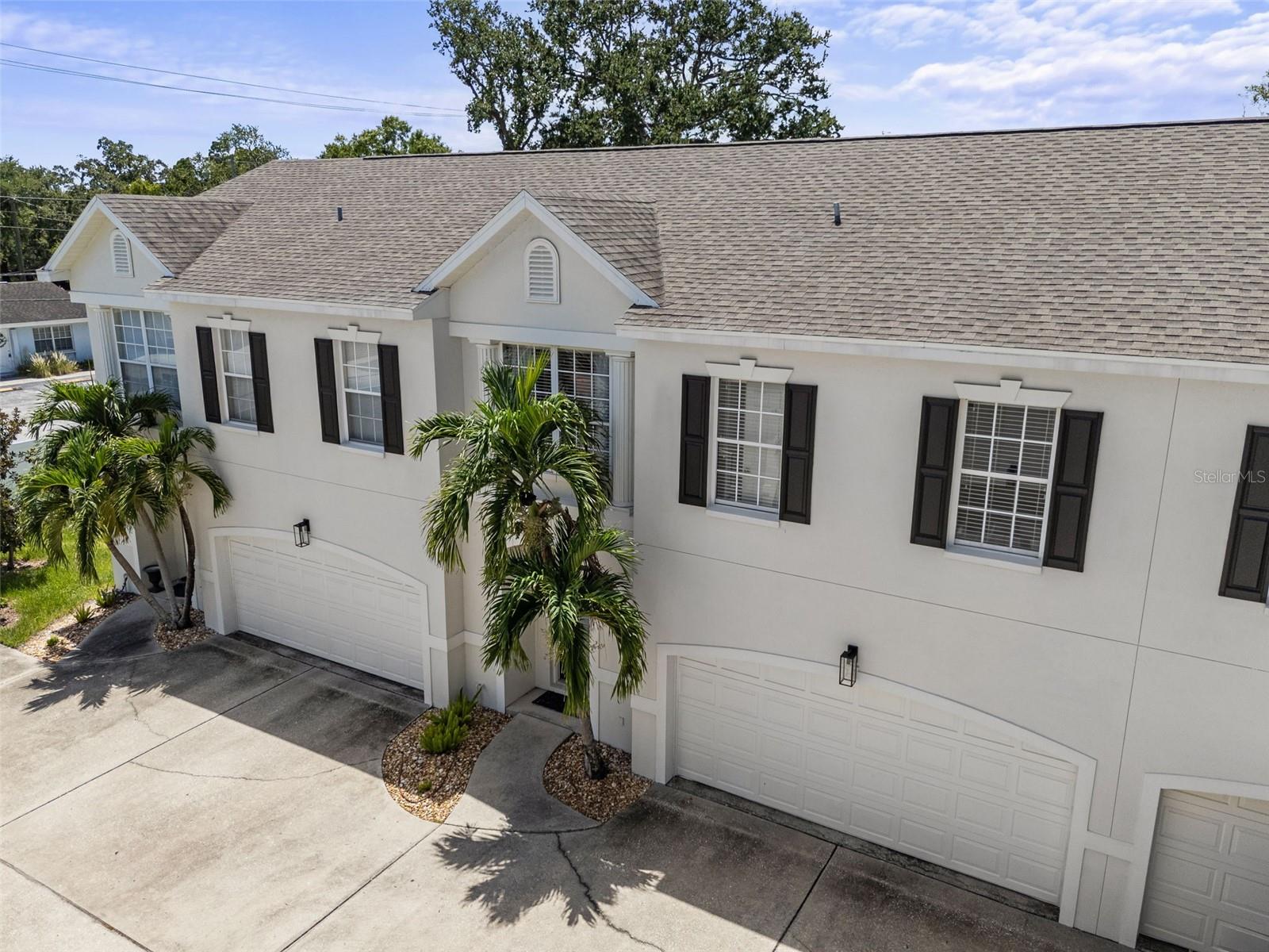 Discover your new residence within the exclusive, gated community of Park West Condominiums, an intimate enclave of only six units in South Tampa not in a flood zone. This exceptional 3 bedroom, 2.5 bathroom townhome style home impresses from the moment you enter, with elegant crown molding, beautiful flooring, and an open floor plan including a dedicated dining area. The spacious living room is bathed in natural light, featuring a large window, and sliding door access to the private patio. Adjacent to the living space, the immaculate kitchen is equipped with two bar stool counters, stainless steel appliances, stone backsplash, and clever storage solutions like Lazy Susan cabinets and a deep pantry. Step outside from the kitchen or living room onto your private patio, which offers wood decking and the privacy of white vinyl fencing. Upstairs, the generous primary bedroom features two windows, and spacious walk-in closet. The en-suite primary bathroom showcases porcelain tile floors, a dual vanity with leather finished quartzite countertops, and a custom tile shower complete with a window for natural light. The two guest bedrooms share a well-designed Jack and Jill bathroom that includes a tile shower and bathtub combo, and a stone vanity topped with a decorative framed mirror. For ultimate convenience, the laundry room is also located on the second floor equipped with a washer & dryer, built-out shelving, and a separate built-out linen closet. This home is complete with an attached 2-car garage and attic access for additional storage. HVAC is 2019, HOA replaced roofs in 2016, HOA repainted exterior buildings in 2023.Park West Condominiums of Tampa consists of only 6 units is situated in top rated Mitchell, Wilson and Plant School Districts, while also conveniently located near SoHo, Hyde Park, downtown Tampa, the Tampa International Airport, and Raymond James Stadium.