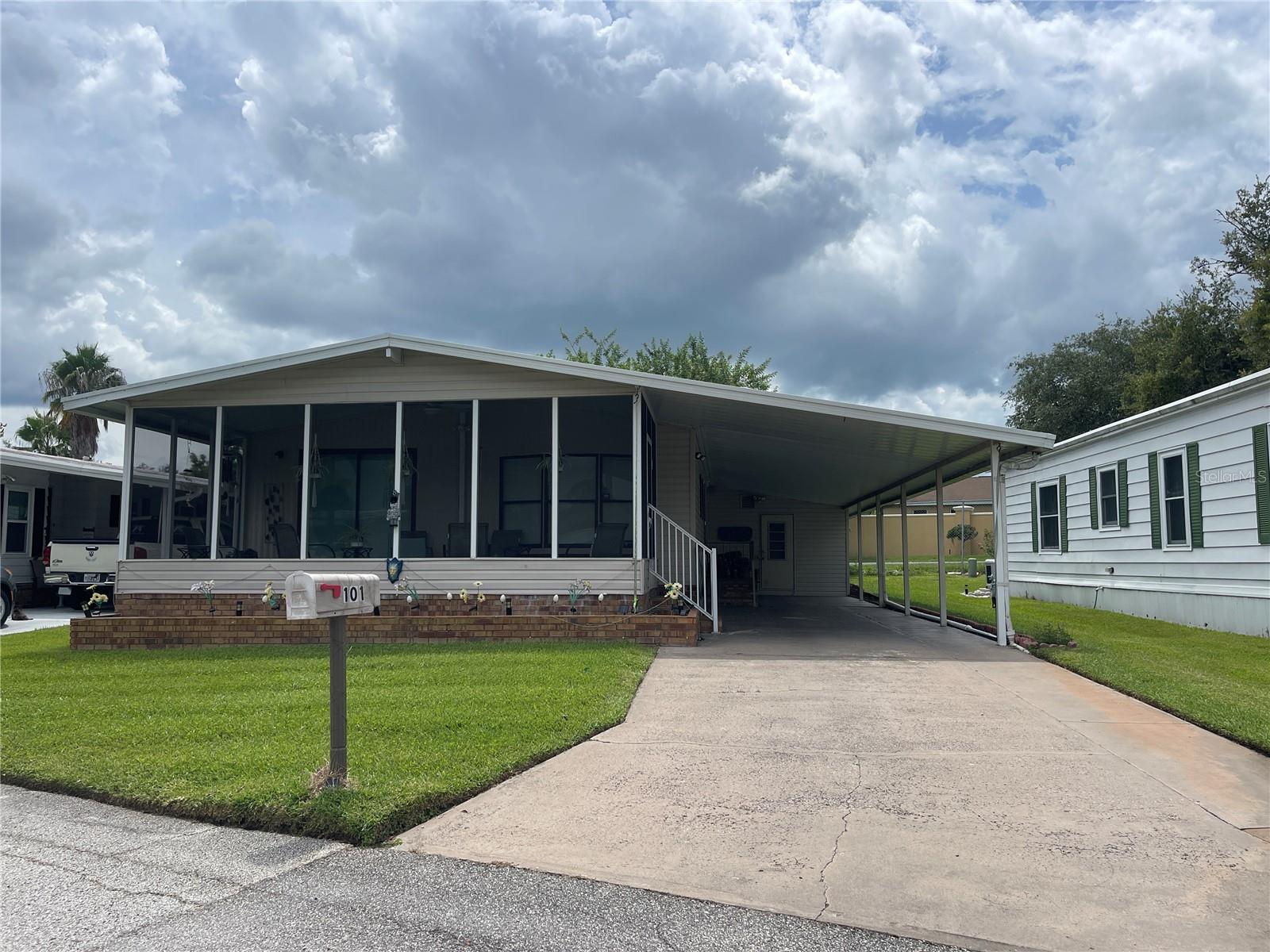 Come enjoy living in Winter Haven's well maintained community for active adults 55+. Home is located in Shipp Reck Harbor on one of the nicest lots around! Manufactured home, great location, you will have a monthly lot fee, that includes, cable, trash pick up, community center, pool and nightly gated entrance. This two bedroom two bath home is very spacious. Primary bedroom has a generous walk in closet, large space for king bed and additional furnishings. The convenient bath has dual vanity and separate shower area so getting ready is a breeze! The guest bedroom is comfortable and near to the guest bath with full tub shower combo. Plenty of closet and storage spaces abound. Your favorite spot will be the large front screen room that has views of the pond and seasonal views of Lake Shipp. Go Fishing in the community pond or try the docks on Lake Shipp Park across the road. The homes floor plan is perfect for entertaining with the dining area and living room in the front of the home. The dining area has built in cabinetry with a faux stain glass cabinet and a beautiful bay window seat. The Galley kitchen is fully equipped and all appliances remain. New ROOF 2018! The neighborhood has a really nice pool and clubhouse. You will also find shuffleboard courts and horse shoe pits available. There are community activities throughout the year to get together with neighbors and even weekly Bingo parties! This home has a very nice covered carport that can accommodate two cars under cover, plus an additional long driveway for guest parking. Winter Haven has much to explore with a great chain of lakes, boat rentals, Legoland and weekend Farmers Market in the town square. The town square hosts events throughout the year with car shows and holiday markets too. There are numerous restaurants to try, shops, outfitters, and the library with coffee shop. This really pleasant town offers an easy commute to the Tampa or Orlando airports. Beaches are less than an hour away to either coast. This is a perfect Central Florida location, and a great place to enjoy the warm Florida sunshine!