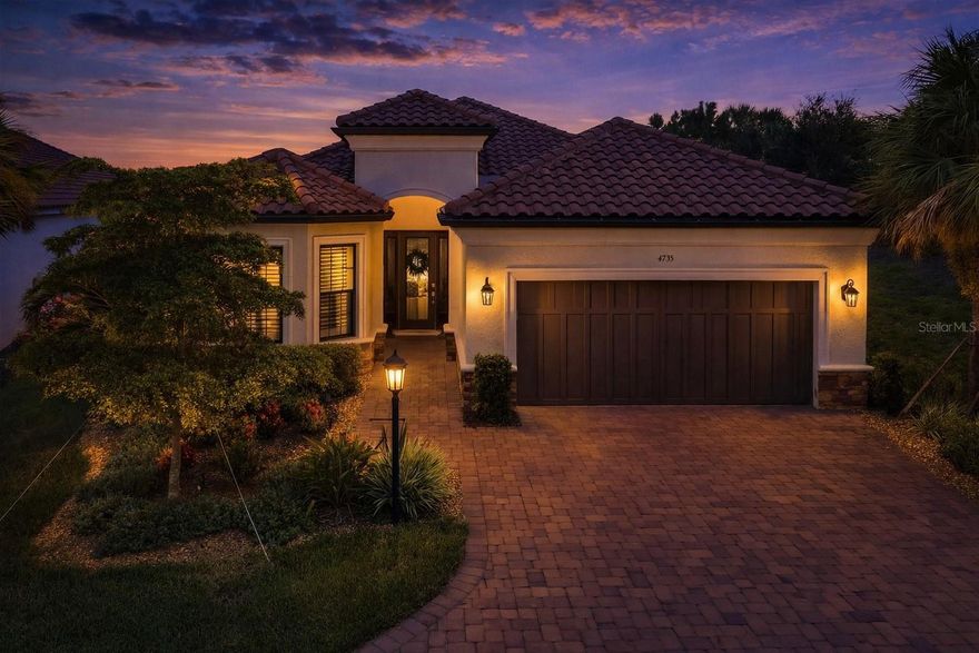 Resort-style living leads at Esplanade at Azario, Lakewood Ranch. Wake up to an amenity rich menu that feels like vacation every day: the spectacular infinity pool with cabanas, a stand-alone Culinary Center for elevated dining, the casual Bahama Bar, an exceptional, fully equipped fitness center, salon & spa services, vibrant social programming, and courts for pickleball, tennis, and bocce— scenic trails, and easy golf-cart access to it all. This is the lifestyle buyers come to Azario for—active, social, and effortless.

From that resort experience, come home to a 2022-built 4-bedroom + bonus/den, 3-bath pool home set on a private corner cul-de-sac lot with tranquil water views and south east facing pool deck. An open, light-filled great room plan connects seamlessly to the outdoors through wide sliders onto an extended panoramic-screened lanai, designed for year-round Florida living. The showpiece outdoor kitchen elevates alfresco evenings with marble countertops and a top-of-line Blaze grill, perfectly positioned beside the sparkling freshwater pool.

At the heart of the home, the chef’s kitchen pairs elegant quartz surfaces with an oversized island with seating, 42" soft-close cabinetry, designer tile, and 2022 stainless appliances—ideal for casual breakfasts or entertaining friends after a day on the course or courts. A tray-ceiling great room enhances volume and natural light.

The private owner’s wing delivers a restful retreat with a spa-style frameless walk in shower, dual vanities, and an expansive custom fitted closet. Thoughtful upgrades continue throughout: every closet features custom built-ins for organized living; custom blinds add a polished finish; and a HOA-compliant gutter system supports low-maintenance ownership.

Car enthusiasts and hobbyists will love the 3-car tandem garage, fully finished with a premium 3-layer polyaspartic floor coating engineered for superior durability and longevity compared to traditional epoxy and extensive custom cabinetry that maximizes storage while keeping the space looking clean and refined.

Additional highlights include flexible spaces for today’s needs: four true bedrooms (one easily doubles as a home office) plus a separate bonus/den, giving you options for a second office, media room, or fitness studio. Quality finishes, fresh 2022 systems, and a water-view setting make everyday living feel elevated and effortless.

Why Azario: beyond the headline amenities—Culinary Center fine dining, Bahama Bar, first-class fitness center, multiple racket courts, bocce, spa/salon, pay-as-you-play golf, community and satellite pools—residents enjoy an active calendar and a welcoming, resort atmosphere that’s hard to find and easy to love. All of it in the nation’s top-selling master-planned community, Lakewood Ranch, close to beaches, restaurants, shopping, and A-rated conveniences.

Move-in-ready luxury in Azario’s signature resort community. Come see how beautifully the home, water view, and lifestyle come together here. Non Golf Deeded.