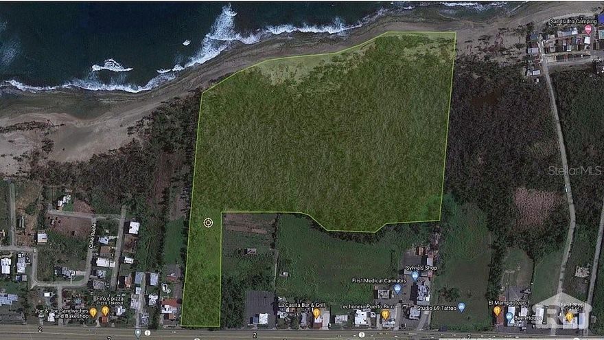 Land of 21 cuerdas flat. The property is located in a high traffic area (PR-2), less than quarter mile from HOme Depot. The property has direct access to the beach, perfect for a eco-touristic development, commercial and or residential.