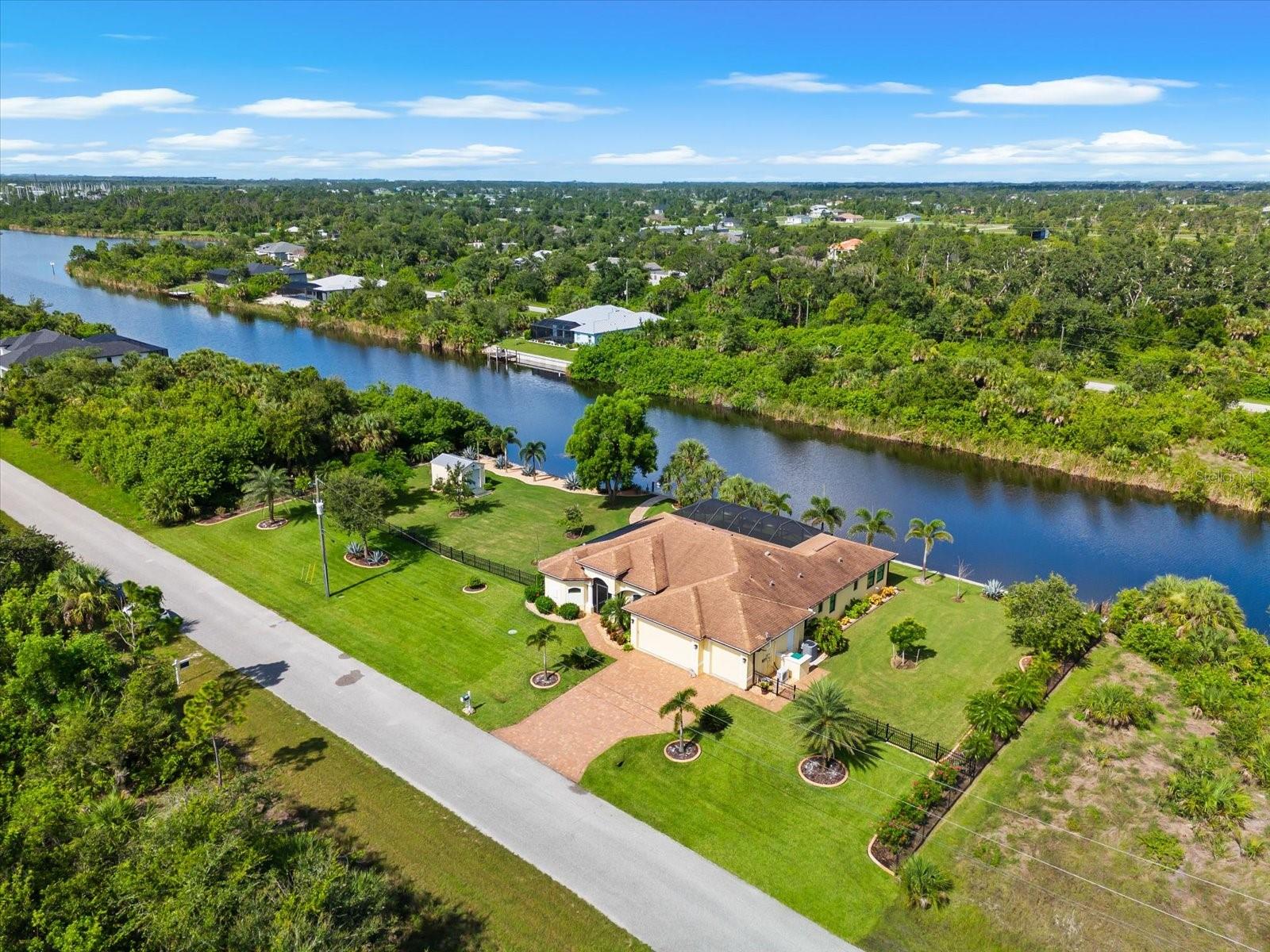 Coastal Waterfront Living on Triple Lot | Fully Furnished | 3BR + Bonus Room | 3BA | 3-Car Garage
Embrace the laid-back coastal lifestyle in this beautifully crafted custom 3-bedroom, 3-bathroom home with a bonus 4th room (featuring a closet), perfect for guests, crafts, or a home office. Located on an exceptional TRIPLE WATERFRONT LOTS with 240 feet of shoreline, this property is designed for those who appreciate serenity, space, and the beauty of waterfront living—with water views from nearly every room in the house.
Enjoy peace of mind with impact-rated windows and doors, accordion shutters, and a vinyl seawall with riprap for added protection. The yard is fully irrigated and professionally landscaped with lush St. Augustine sod, concrete curbing, and low-maintenance rock beds, delivering both curb appeal and functionality.
Inside, you’ll love the thoughtful features throughout—from plantation shutters, custom closets, and soft-close cabinetry with pull-out drawers, to three oversized pantries in the laundry area that offer plenty of storage for everyday convenience. The open-concept living room includes a custom built-in entertainment center, while the sun-drenched bonus room lined in windows is perfect for reading, relaxing, or soaking in peaceful views and birdwatching.
The saltwater pool with a solar heating system and waterfall feature invites year-round enjoyment, all while overlooking the tranquil canal setting. The spacious 3-car garage is outfitted with insulated garage doors and a mini-split A/C unit, making it a comfortable and climate-controlled space for hobbies or extra storage. A shed adds even more room for your tools or toys.
Situated in a warm and welcoming community with a park and playground, you're just 10 miles from world-class Gulf beaches, and close to golf courses, restaurants, shopping, and more.
Offered fully furnished, including a Club Cadet riding mower with catcher bag and two kayaks—this home is truly move-in ready. Whether you're looking for a full-time residence or a seasonal retreat, this waterfront gem checks every box for effortless Florida living.
