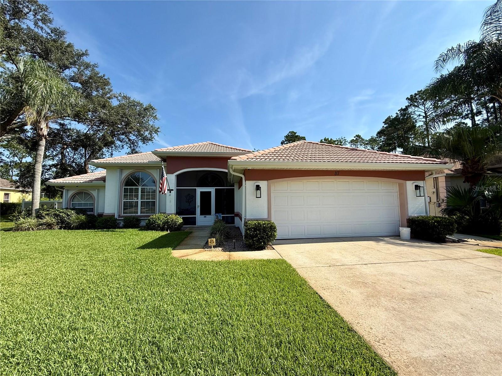 You will not find another property like this in Palm Coast! Welcome to this beautifully maintained 3-bedroom, 3-bathroom pool home nestled on over an acre of fully fenced property, offering privacy, space, and a wide range of valuable upgrades. Backing up to the Cypress Knoll Golf Course, the home provides tranquil views and no rear neighbors, creating a peaceful and private retreat. Inside, you'll find a spacious split-bedroom layout with a well-appointed kitchen featuring granite countertops. The home is equipped with a 3-ton, 16 SEER A/C system installed in May 2018, complete with a UV Active Ionic Air Purifier to ensure year-round comfort and enhanced indoor air quality. All three full bathrooms provide functionality and comfort, and a new hot water heater was installed in 2024. Step outside to enjoy a beautifully resurfaced pool (2017) with a Nano Saltwater System with a powerful 400,000 BTU pool/spa heater, perfect for relaxing or entertaining. The pool deck was updated in 2023 with long-lasting Shark Coating, and an outdoor shower adds extra convenience. The home is storm-ready with accordion hurricane shutters on the front and side windows and hurricane fabric covering all other openings. A 12kw dual-fuel whole home generator (gasoline/propane) offers peace of mind during power outages, and the property also currently has a termite bond for ongoing protection. The front and backyard are irrigated by a well-fed sprinkler system, keeping the landscape lush year-round. With its combination of thoughtful upgrades, serene golf course views, and a spacious lot, this move-in ready home offers the perfect blend of comfort, style, and functionality in a prime location.