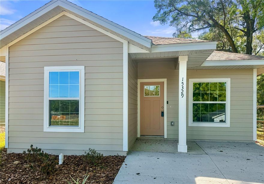 3-bedroom, 2-bath newly constructed home in Alachua, FL offering approximately 1,243 heated square feet with an open and efficient floor plan. The main living area connects seamlessly to the kitchen and dining space, creating a functional layout for everyday living.

Interior finishes include quartz countertops, wood cabinetry, luxury vinyl plank flooring throughout, and contemporary lighting and fixtures. The kitchen features ample cabinet space and a full appliance package.

The split-bedroom layout positions the primary bedroom toward the rear of the home, while two additional bedrooms and a full bathroom are located near the front. The primary bathroom includes a walk-in shower.

Additional features include a covered front entry, indoor laundry area, and Ring doorbell. Conveniently located near I-75, shopping, dining, and Gainesville.