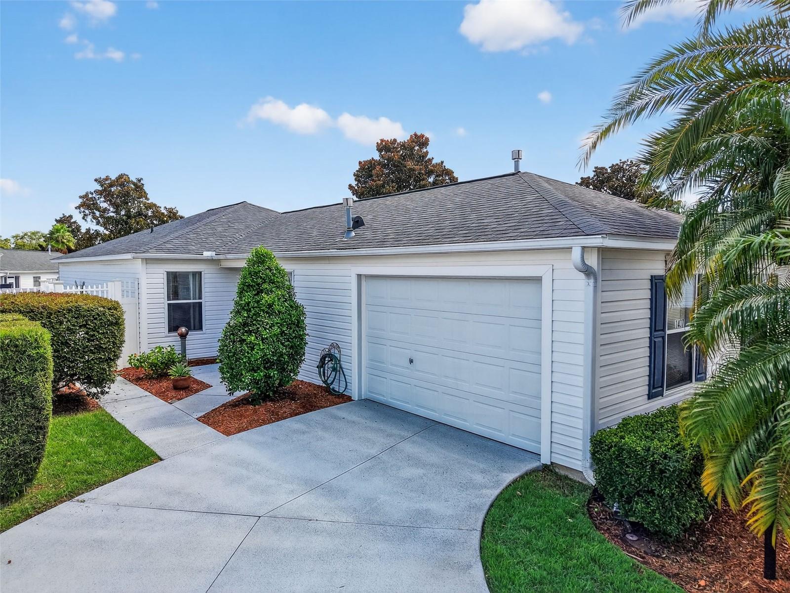Welcome to this beautiful 3 Bedroom, 2 Bathroom COURTYARD VILLA located in Liberty Park in The Villages! This charming BONITA model is a perfect fit with a NEW roof. Step inside and enjoy the VAULTED CEILINGS that reflect across most of the home, giving it a warm and welcoming atmosphere. You'll find NO CARPET here, just LUXURY VINYL PLANK FLOORING that makes for a clean, modern, and easy-to-maintain lifestyle. NATURAL LIGHT fills the space, providing that bright Florida ambiance. This full 3 bedroom Villa comes with fans and closets in every room, with the owner's suite boasting its own en-suite bathroom. The kitchen seamlessly connects to the dining and living areas, featuring an eat-at island, contemporary cabinetry, and updated lighting. In addition, the indoor laundry room adds extra storage and a wash sink for convenience. ENJOY the screened LANAI with river rock flooring, or the open patio area, the ideal spot to sip your morning coffee or unwind in the evening, all while enjoying a Fully Private Backyard with a Privacy Wall. Whether you're entertaining guests or relishing the tranquility of your own sanctuary, this home has it all. It's conveniently situated right between Lake Sumter and Brownwood, making golf cart access a breeze. The Villages Lifestyle is at your fingertips, with endless shopping, dining, and entertainment options, plus NIGHTLY LIVE MUSIC to enjoy under the stars. Don't wait—schedule your private showing today!