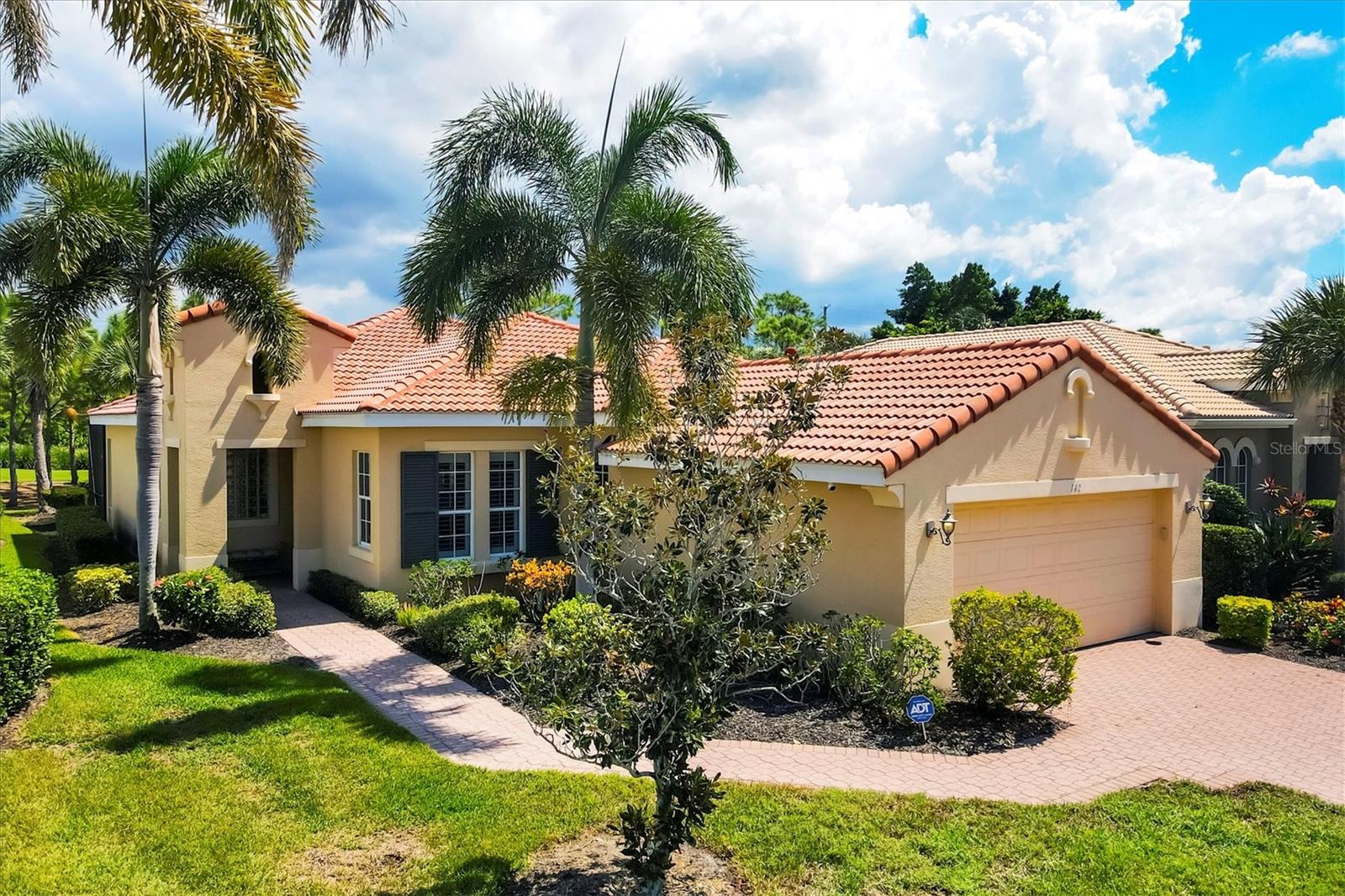 Offered TURNKEY FURNISHED exceptional WCI-built Extended Dolci model home perfectly positioned on the 17th fairway of a championship golf course. This thoughtfully designed 3-bedroom, 2-bathroom residence showcases 1,621 square feet of comfortable living space with an open great room layout enhanced by soaring tray ceilings that create an impressive sense of grandeur.
The heart of the home features an upgraded kitchen equipped with gas appliances, solid wood cabinetry, granite countertops, a convenient pantry, breakfast bar, and eat-in area. The expansive screened lanai serves as your private oasis, complete with a sparkling heated pool and spa where you can unwind while enjoying tranquil golf course views.
The generous primary bedroom offers serene fairway vistas, elegant tray ceilings, dual sinks, a relaxing garden tub, walk-in shower, and spacious walk-in closet. Throughout the home, you'll appreciate the diagonally laid tile in common areas, neutral carpeting in bedrooms, Hunter Douglas window treatments, and elegant lighting fixtures. The third bedroom features charming French doors, while accordion hurricane shutters on the lanai provide peace of mind.
This residence is located within the Venetian Golf and River Club community, where residents enjoy access to a Chip Powell-designed 18-hole championship golf course, six Har-Tru tennis courts, a fitness center with classes, lap pool, resort-style pool with tiki bar, fine dining options, and a scenic boardwalk through a nature preserve. The homeowners association conveniently handles lawn care, palm tree trimming, and mulching, allowing you to focus on enjoying the Florida lifestyle.