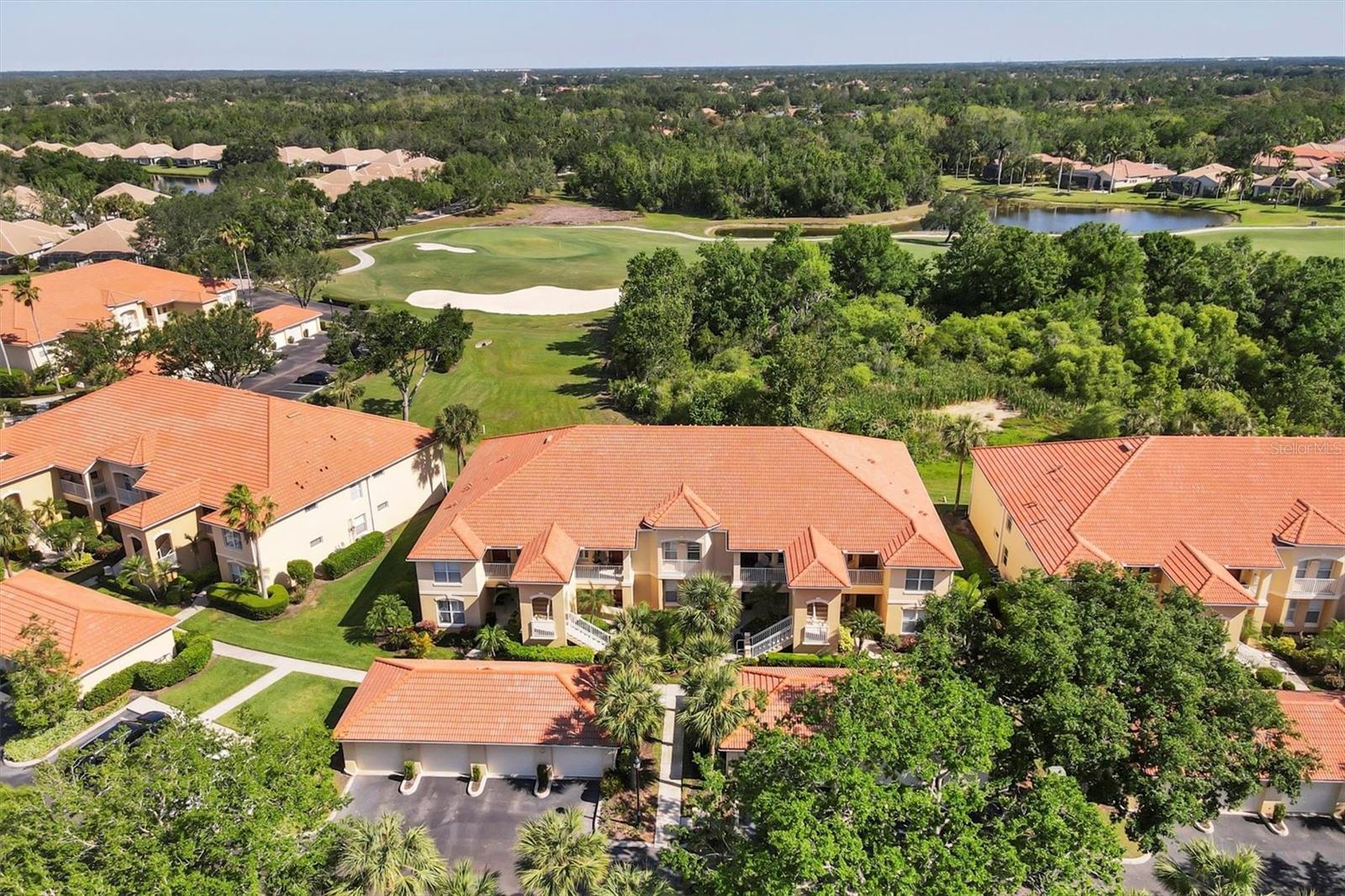 Welcome to Boca Grove, a tranquil gated community nestled in the highly coveted Lakewood Ranch Golf & Country Club. This meticulously maintained TURN-KEY FURNISHED 2/2 + DEN, END UNIT condo has magnificent views of the 16th fairway on the Arnold Palmer designed Legacy Golf Course. With soaring vaulted ceilings and a bright open floor plan this home offers the perfect blend of comfort and sophistication. The spacious kitchen is ideal for entertaining, featuring white cabinetry, Corian countertops, a breakfast bar, and a charming nook for casual dining. The adjacent living and dining areas open to a screened lanai through a wall of sliders, creating a seamless indoor-outdoor living experience. The Primary bedroom is a serene retreat, with 2 spacious walk-in closets and en-suite bath featuring a double vanity and walk-in shower. A versatile den/office with pocket doors provides an ideal workspace or flex space. The guest bedroom and additional bath, accessible through a pocket door off the foyer, ensure privacy for visitors. Enjoy maintenance-free lush landscaping and the convenience of a 1 car garage. Just steps to the Boca Grove clubhouse, community pool, and spa - perfect for socializing with friends & neighbors. Lakewood Ranch Country Club offers optional golf, social, and athletic memberships, there is something for everyone! Lakewood Ranch is the #1 top-selling master-planned community in the country with vibrant lifestyle, countless community events, shopping, dining, polo, A-rated schools, and, of course, Sarasota’s renowned beaches. Enjoy the Country Club Lifestyle that's affordable and Maintenance-Free.