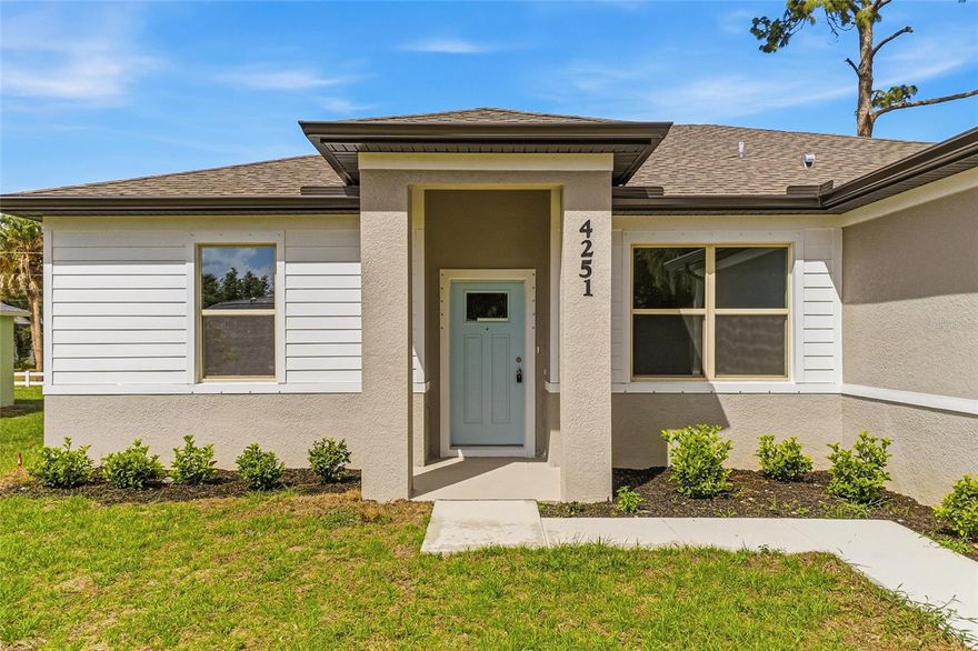 Excellent price with luxury features and move-in ready! A brand new home with city water and septic system in North Port – no HOA fees! Great location! Ideally located for quick access to Highway 41, shopping, schools, medical facilities, Warm Springs Park, and the Aquatic Park. This affordable new home is ready for you and is just what you've been looking for... No HOA fees and city water! This home features 9-foot ceilings, a spacious and open layout with a versatile floor plan. The home has 4 bedrooms, 2 full bathrooms, a formal dining room, a living room, an open kitchen, and a two-car garage, with 1,810 square feet of living space. The living space is well-utilized, with high ceilings and numerous windows providing natural light. The interior finishes will provide you with the quality and luxury you were looking for in your new home. This home has a split floor plan, with the primary suite on one side and the guest bedrooms on the other. The primary bedroom has tray ceiling and large windows allowing for plenty of natural light. You will also enjoy a spa-like bathroom with a spacious walk-in shower with floor-to-ceiling tiled walls and a glass enclosure. It also features a linen closet, a double vanity, and a large walk-in closet. The living room has large windows and several LED light fixtures providing ample light, with access to the covered lanai. The living room is open to the kitchen, where you will find a large center island with additional seating for casual dining and plenty of cabinetry. The kitchen features stainless steel appliances, Shaker-style cabinets with crown molding , decorative hardware, a subway tile backsplash, and granite countertops. The dining room is located at the front of the house, with large windows allowing for abundant natural light. The home includes luxury vinyl plank flooring in the main living areas and bathrooms for durability and comfort. You'll love these floors! They are easy to maintain and offer a modern design, perfect for new homes. Other features include the same beautiful Shaker-style cabinets with hardware and granite countertops in the bathrooms, 5-inch baseboards, a garage door opener, exterior gutters, R38 insulation, a 16 SEER HVAC system, and much more. Visit our showroom and compare the features and quality to other homes, and you'll see the difference. We make buying easy for you! The photos and videos are the same floor plan, but different location.