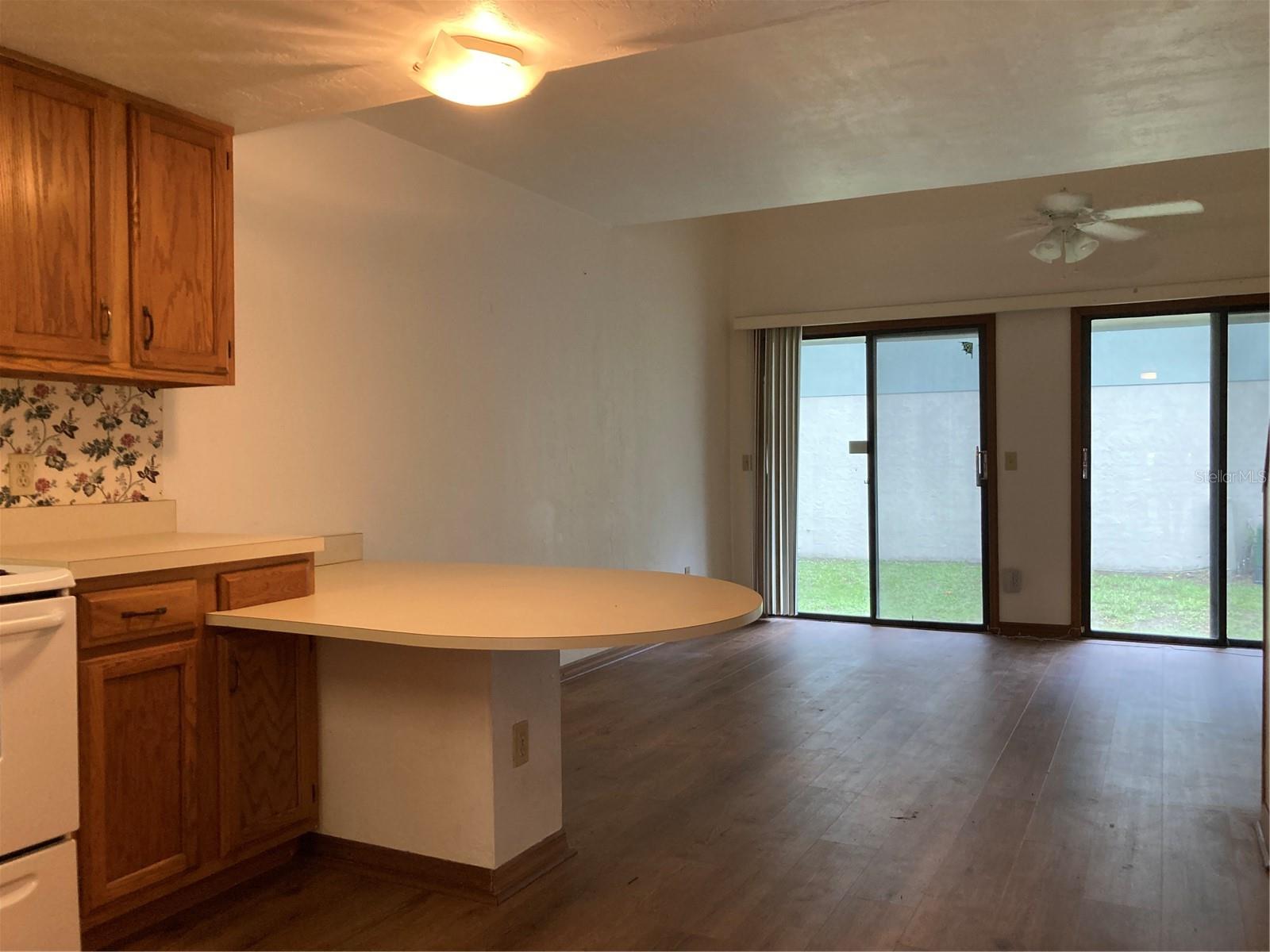 Very nice one bedroom townhome with inside laundry, beautiful luxury Vinyl flooring throughout the apartment. In the first floor you will find the entry hallway, kitchen with a built-in table/breakfast bar, living room that opens to the backyard, half bath for guests, storage and laundry, in the second floor: the bedroom with a full bath, two good size closets, and a study loft/work station. The double height makes this home feel brighter and larger. The community offers a pool and parking is just in front of the access door. This neighborhood is on the bus line and just a short distance to UF, Butler Plaza, Walmart, restaurants, shopping and easy access to I75. Family friendly and tranquil place to live.