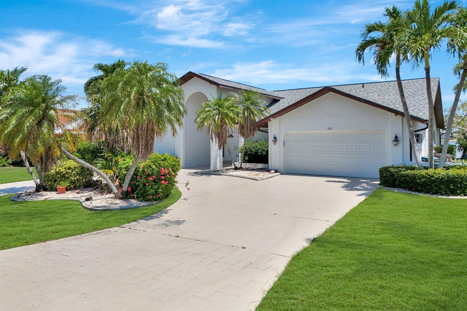 RENOVATED 8 LAKES POOL HOME! Enjoy the ultimate Southwest Florida lifestyle in this completely updated Gulf-access pool home located in Cape Coral’s coveted 8 Lakes neighborhood. This spacious 3-bedroom, 2.5-bath residence offers over 2,500 square feet of living space with a split-bedroom layout designed to maximize the LONG WATER VIEWS. Step inside to find vaulted ceilings, walls of windows, and an open concept living area that flows seamlessly into BRAND NEW KITCHEN kitchen featuring granite countertops, stainless steel appliance package, white shaker cabinetry, island prep area, and a generous breakfast bar. The kitchen overlooks the pool area and lanai, offering beautiful LAKEFRONT views while you cook or entertain. The main living space opens through sliding glass doors to a large screened lanai. Outdoor living is what SWFL is all about and this home will not disappoint! Lanai features half bath, extra storage and lots of room for outdoor seating and dining alike. The pebble tech pool was refinished recently and is ideal for relaxing, entertaining, or enjoying the Florida sunshine. The owner’s suite features direct lanai access, a walk-in closet, and an ensuite bath designed like a modern wet room, fully tiled with dual vanities, a soaking tub, walk-in shower for a spa-like experience complete with walk out exterior atrium. Two guest bedrooms are tucked away on the opposite side of the home and share a updated full bath. Additional highlights include NEW ROOF (2023), fresh paint inside and out, new LVP flooring, formal dining room, interior laundry room, utility sink, new washer and dryer, and a two-car garage. A BRAND NEW composite dock with boat lift and captain’s walk is ready for use! With only a 25-minute boat ride to open waters, this home is a boater's paradise, offering easy access to the Gulf of Mexico. Indulge in the ultimate Florida lifestyle with this updated home in a premium location that has WIDE WATER VIEWS all within reach of the area's finest amenities and attractions. Schedule your private tour today and experience waterfront living at its absolute finest.