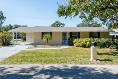 Discover tis charming one-story concrete block home in the desirable Ballast Point area of Tampa. Offering three bedrooms and two bathrooms within just under 1,200 square feet, this residence is minutes from Bayshore Boulevard, MacDill Air Force Base, and the vibrant shops, dining and entertainment of South Tampa.  Enjoy the convenience of being just a short drive from Tampa International Airport or Downtown Tampa.  The layout features a spacious living area that flows into the kitchen, creating a welcoming environment for gatherings.  
A large laundry room/pantry off the kitchen adds practicality, while a storage room off the carport provides extra space.
Built to last, this home features a new roof and has not experienced flooding in hurricanes.