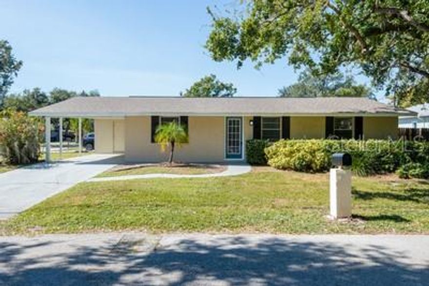 Discover tis charming one-story concrete block home in the desirable Ballast Point area of Tampa. Offering three bedrooms and two bathrooms within just under 1,200 square feet, this residence is minutes from Bayshore Boulevard, MacDill Air Force Base, and the vibrant shops, dining and entertainment of South Tampa.  Enjoy the convenience of being just a short drive from Tampa International Airport or Downtown Tampa.  The layout features a spacious living area that flows into the kitchen, creating a welcoming environment for gatherings.  
A large laundry room/pantry off the kitchen adds practicality, while a storage room off the carport provides extra space.
Built to last, this home features a new roof and has not experienced flooding in hurricanes.