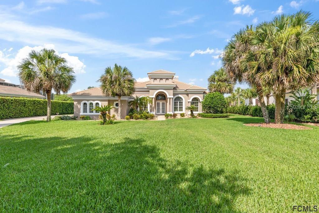 Sweeping views of the Intracoastal waterway from this custom-built Arthur Rutenberg residence situated on 1.4 acres with 206ft of Intracoastal frontage. This 4 bedroom, 3.5 bath offers plenty of room for a large family. The open kitchen features tons of cabinets, new Kitchenaid appliances, and a butler's pantry with a wet bar leading into the formal dining room. Bring the outside in with 90-degree disappearing sliding glass doors that open to an incredible screened lanai outdoor living area with a pool and hot tub with a large cascading waterfall, fireplace, summer kitchen, and gas grill overlooking the Intracoastal waterway. Keep your water toys in the boathouse with a 10k pound boat lift and two jet ski lifts. Don't miss this rare opportunity to own in the coveted, private, gated, and guarded property in Island Estates.