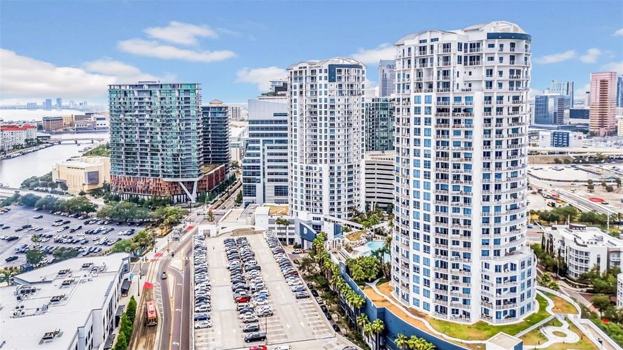 Seller is offering a $20,000 concession to buyer upon an acceptable offer! Welcome to Elevated Living on the 20th Floor! Step into elegance in this stunning high-rise condo, where panoramic, unobstructed views stretch from sunrise to sunset. A wraparound balcony invites you to savor every moment of Tampa’s skyline from the 20th floor. Behind elegant double doors, discover a beautifully updated interior featuring brand-new flooring throughout, two spacious bedrooms, two full bathrooms, and an additional powder room. The chef-inspired kitchen is perfect for entertaining, boasting high-end new appliances, upgraded countertops, and modern cabinetry. Resort-style living awaits with a range of premier amenities: Downtown’s best pool and spa, Community clubhouse, 24-hour security, Two secure parking spots, Climate-controlled storage unit ,Dog parks & bike storage. All just steps from the vibrant heart of downtown Tampa! Located just blocks from the exciting Water Street development, you’ll be minutes from top dining, shopping, Amalie Arena, and world-class entertainment. Schedule your private tour today — this is luxury redefined.