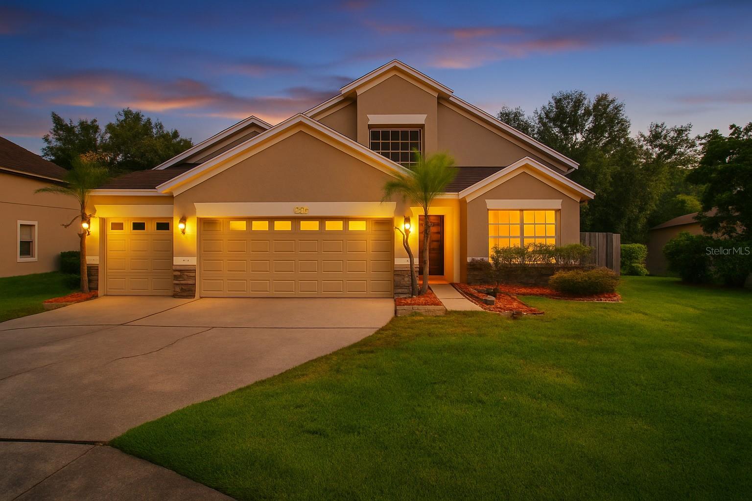 Welcome to this beautifully renovated 4-bedroom, 2.5-bathroom pool home located in the highly sought-after community of Thousand Oaks. With 2,396 heated square feet and 3,317 total square feet, this spacious home sits on a fully fenced 0.20-acre lot, offering both privacy and comfort in a well-established neighborhood. From the moment you arrive, you’ll be captivated by the stunning curb appeal, enhanced by manicured landscaping, palm trees, and a charming front garden. Step inside to discover brand new luxury vinyl plank flooring and an open layout that creates a light and airy atmosphere throughout. The heart of the home is the fully updated kitchen, featuring brand-new stainless steel appliances, quartz countertops, and sleek cabinetry that's perfect for both everyday living and entertaining. Each of the four bedrooms is filled with natural light, thanks to large windows that give the home a bright and inviting feel. The primary suite offers a spa-like en-suite bathroom complete with a stand-up tiled shower and a separate sit-in tub for ultimate relaxation. A sliding glass door leads to the screened-in pool patio, where you can enjoy outdoor dining, entertaining, or quiet evenings overlooking the large backyard. This outdoor space is ideal for hosting family gatherings or simply watching the sunset in peace.