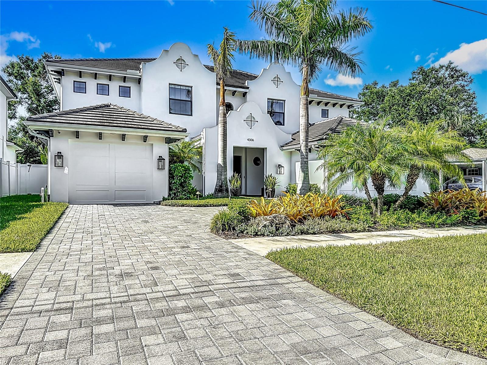 This is an amazing home in the heart of South Tampa. 6 bedrooms, 4.5 baths. Exquisitely designed layout; parlor w/wet bar, Playroom/Study off of Great Room doubles as another bedroom, Downstairs Guest Suite, formal dining, butlers pantry, breakfast nook, and a Huge Mudroom w/bench & cubbies as well as a washer/dryer hook up (for ease w/pool towels or messy uniforms!). Oversized three car garage w/room for workshop and storage, covered rear lanai with outdoor kitchen & pool with spa. Whole house generator, even though it did not flood during hurricanes, gives you piece of mind during storm season. Features; Gray Stained Cyprus Tongue Groove Exterior Ceilings, 6.5" wire brushed wood floors throughout, a Sub Zero Appliance Package, high-end Custom Cabinetry w/stacked glass uppers w/X design at uppers, designer tiles and marble bathrooms, Quartz counter tops to emulate Marble, 8' solid doors, 7" crown, Boxed Beam Great Room Ceiling, Cased Windows, Custom Master BR Closet Built-ins, Smooth Drywall, Recessed electrical outlets in base boards, Icynene Spray Foam Insulation, All Block Construction, Hurricane Impact Rated Windows, 2 Gas Tankless Water Heaters, Water Softner Loop & Tile Roof. Outdoor living leaves nothing to be desired! Saltwater Modern designed pool w/sun shelf and glass mosaic spa, Travertine Deck and Outdoor Kitchen. If you decide you need an elevator, the shaft is already there. This one checks all the boxes. Just a short walk to Coleman Middle school.