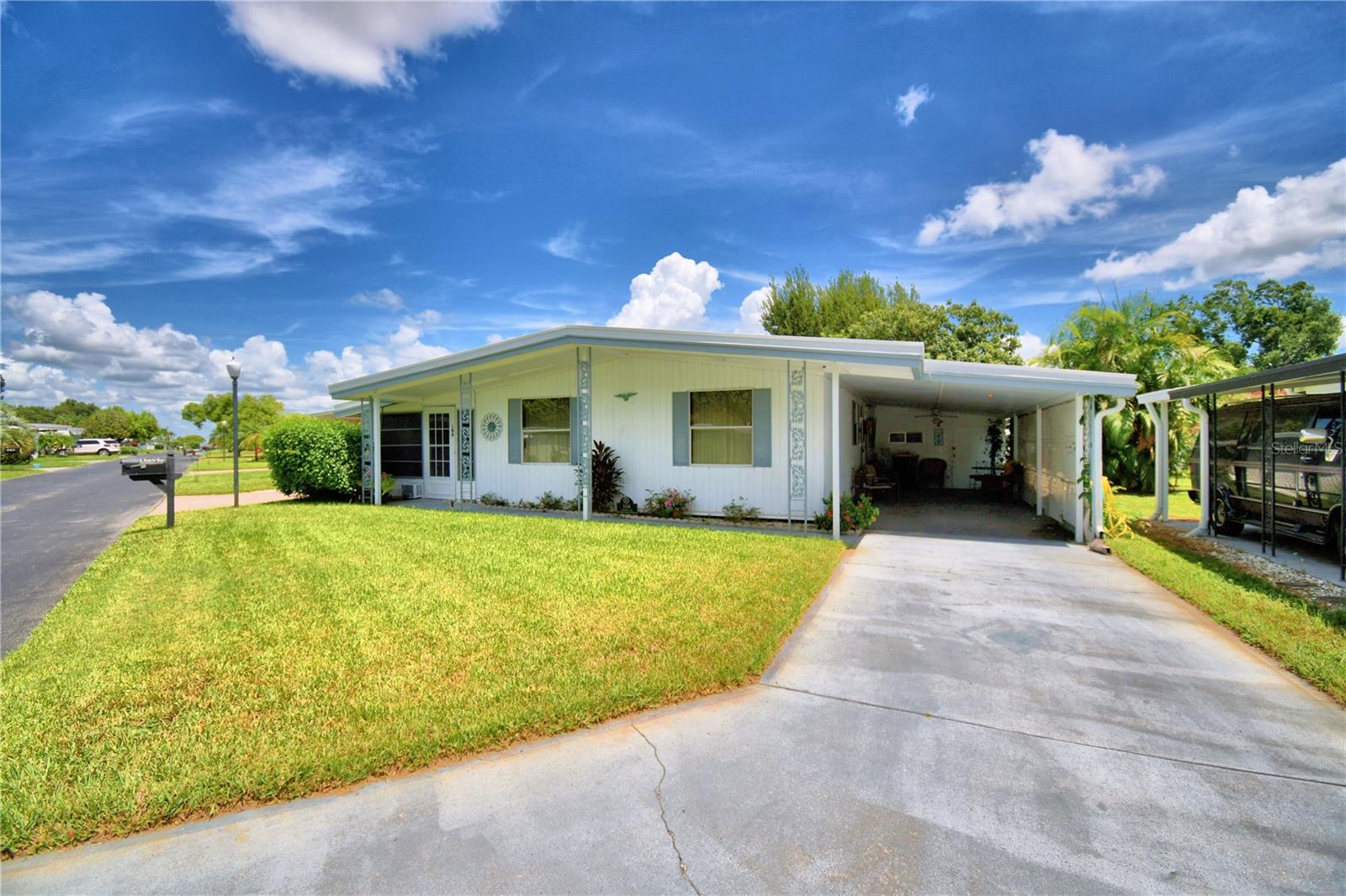 Brand new air conditioner installed in March 2025. Move right into this very well maintained home. All the furnishings come with this home including dishes, silverware, pots and pans. The functional kitchen features newer cabinets and counter tops. The living room is nice sized with the access to the porch off the living room. The primary bedroom has laminate flooring and is quite spacious. And to top it all off, the roof is 1 1/2 years old. Ariana Shores, a 55+ community lays between Lake Ariana and Lake Arietta with access to both lakes. Move right into this beautiful community and enjoy the warm and peaceful winters, or move in to live year around. Make your appointment today.