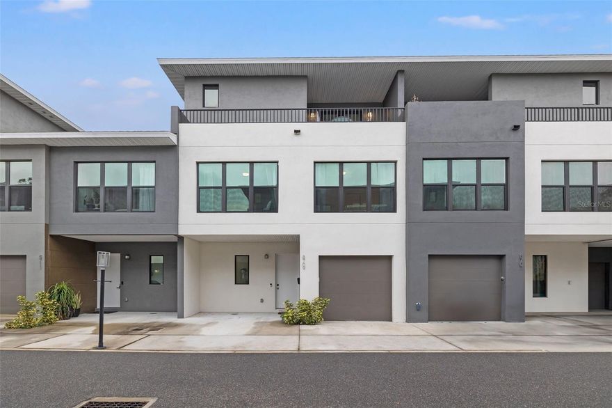 Built in 2021 with sturdy concrete CMU construction, this modern 2,109-square-foot residence offers 3 bedrooms and 3.5 bathrooms along with a low maintenance lifestyle. The first floor features an open floor plan with high ceilings that create an inviting, airy atmosphere for you and your guests. The kitchen includes upgraded appliances, an under mount sink and spacious quartz countertops. The three bedrooms and laundry are located on the second floor, including the thoughtfully designed primary suite with ample closet space. Your en-suite primary bathroom has dual sinks and a huge glass-framed step-in shower. The third floor offers an amazing wide-open flex space, which you could use as a fourth bedroom, spacious office, home gym, hobby space or media room. From there, you can step out onto one of your two private balconies, perfect for enjoying a peaceful morning coffee or relaxing evening cocktail. Located in one of Florida’s most dynamic cities, this home offers easy access to Tampa’s exciting lifestyle. For sports enthusiasts, Raymond James Stadium and Amalie Arena are just minutes away, offering thrilling games and events throughout the year. Food lovers can explore Tampa’s renowned culinary scene, from fine dining to the authentic flavors of Ybor City. With top-rated schools, family-friendly parks, and proximity to the Gulf Coast’s stunning beaches, Tampa provides the perfect blend of leisure and convenience. 8709 Palm Ranches Place combines modern design, accessibility, and the best of Tampa living to deliver an exceptional lifestyle in a premier location.