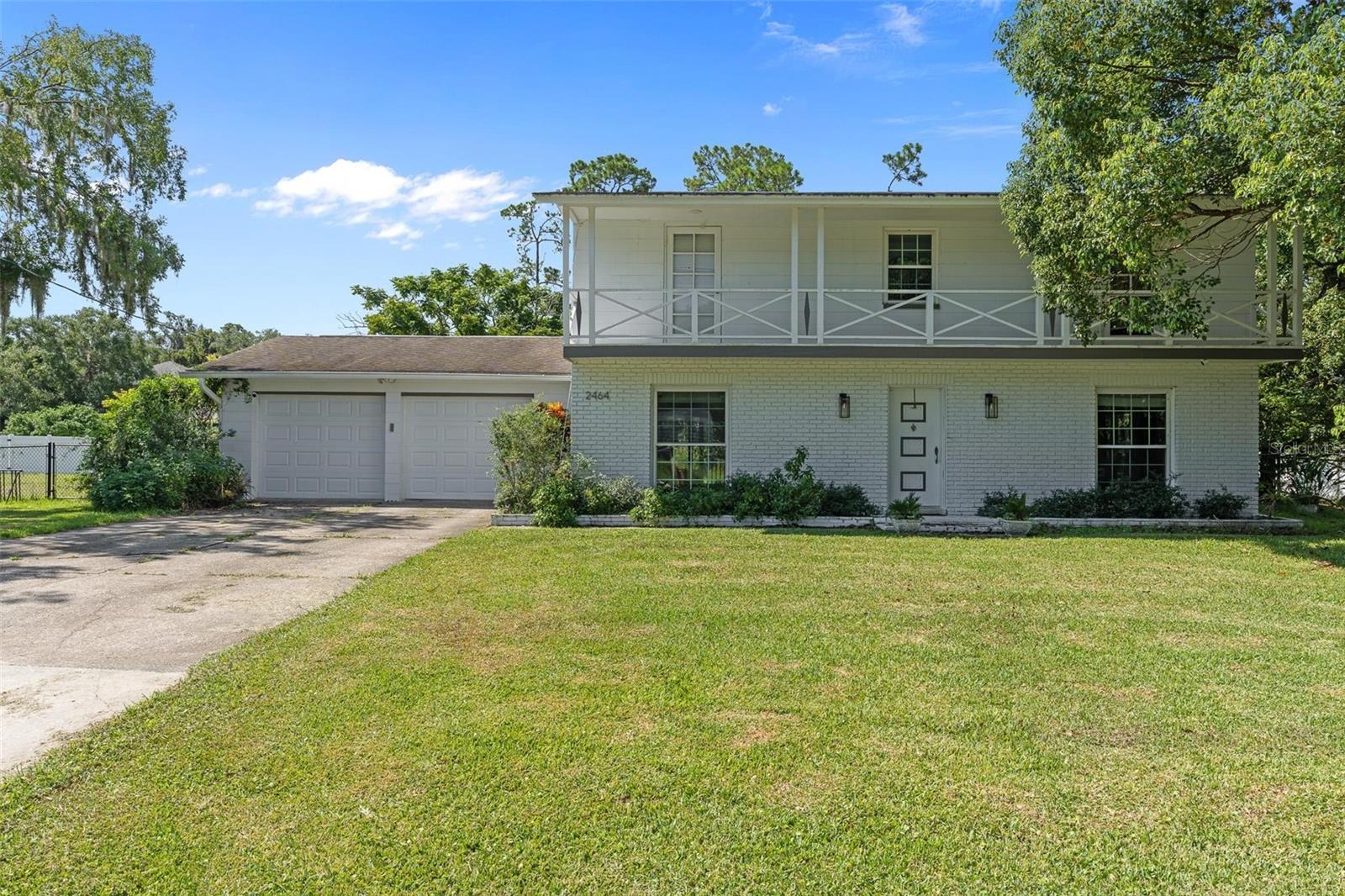 Step into this beautifully remodeled 1963 custom block home, thoughtfully designed to preserve its original character while incorporating modern upgrades. Situated on .40 acres across two parcels, this property offers endless potential for expansion, investment, or multi-generational living. (An additional 9,600 sq ft buildable lot is also available but not included in the sale price.)
Located in the heart of New Smyrna Beach, this home provides the perfect blend of convenience and the beauty of natural Florida surroundings. Built with family in mind, the layout features a galley-style kitchen with custom cabinets and quartz countertops, complemented by tile flooring throughout the main living areas. Upstairs, the original white oak floors (restored in 2017) add timeless warmth and charm.
This home offers plenty of flexible space, including a bonus room on the main floor that could serve as a secondary living area, playroom, or office. Additional highlights include white granite bathrooms and a charming front balcony that spans across two bedrooms.
Designed for light and flow, the interior provides an open and airy feel with custom windows that flood the home with natural light. At its center, a grand custom staircase makes a striking statement piece as you enter the home.
This residence has gone through extensive updates including, Kitchen (2022), updated electrical and plumbing, new windows (2017), roof (2016), Vinyl Fence (2025), septic (2015) and a new AC and Hybrid water heater (2024)—providing peace of mind for years to come.
Step outside into your large, fenced backyard, shaded by mature trees and offering a private retreat in the heart of town. Whether you’re entertaining, gardening, or simply relaxing, this expansive outdoor space provides endless opportunities to enjoy Florida living at its finest. Schedule your private tour today!
Additional parcel ( 7323-04-00-1320 ) is available for purchase, but not included in the sales price. Buyer to Confirm all information.