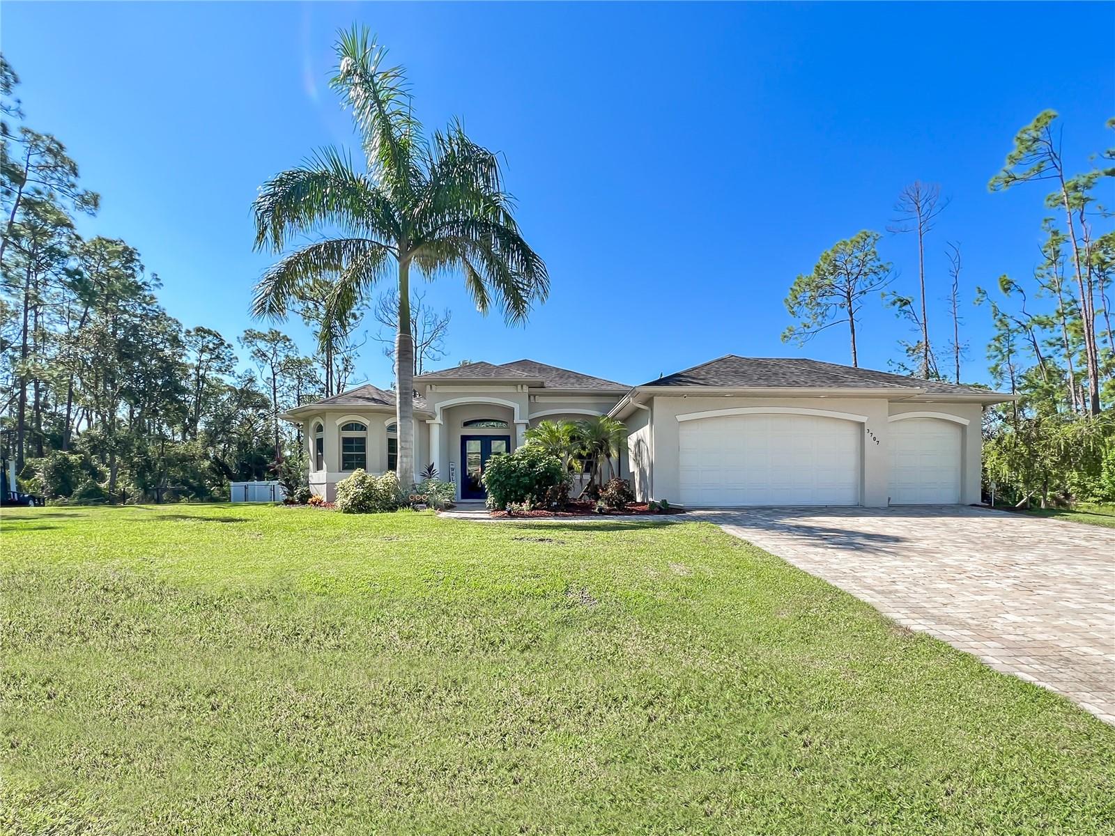Come see this beutiful 2017 BUILT HOME SITUATED ON A MASSIVE DOUBLE LOT: Located in the rapidly growing city of North Port this split bedroom residence offers generous size guest bedrooms, a formal dining room, BONUS office/den, spacious great room, open kitchen, expansive master bedroom and inside laundry room. Interior features include Bosch brand stainless steel kitchen appliances, crown molding, designer fixtures, tiled backsplash, built-in double oven, wine rack, quartz counter tops in the kitchen (granite everywhere else), gas cooktop, slow close cabinet drawers/doors, soaring 9'4" ceilings, 8' interior doors, porcelain plank tile floors throughout with 20" tile in master bath, 5" baseboards, zero edge sliders, walk-in pantry, master shower walk around alcove, dual vanities, whole house R/O system, double tray ceilings, security system, whole house surge protector, built-in mail desk, granite laundry station, tiled showers, his/her closets and pool bath. Exterior features showcase a double door front entry, beautiful heated freeform saltwater pool & spa, paver pool deck, outdoor kitchen with gas grill, outside shower, fenced yard, extra wide driveway, high impact doors/windows, remote control roll down shutters, irrigation system, Tuff Shed on slab, 3 car garage with 8’ tall doors and huge double parcel. Centrally located to shopping, dining, entertainment, golfing, boating waters and Florida beaches. NOT IN A FLOOD ZONE & MOVE-IN READY.