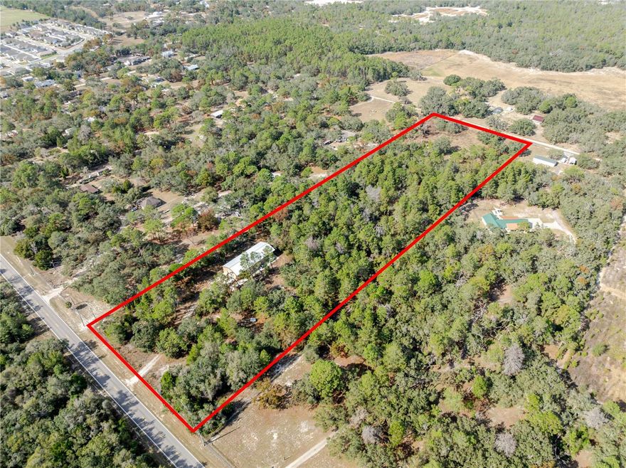 9.66 Acre, Ready to build!!  Property boasts a 40x80 Steel Building, 16 Ft Tall, completed in 2024.  Property already has well and septic.   Building includes overhang for covered RV parking with hookups. New Washer and Dryer in the building.