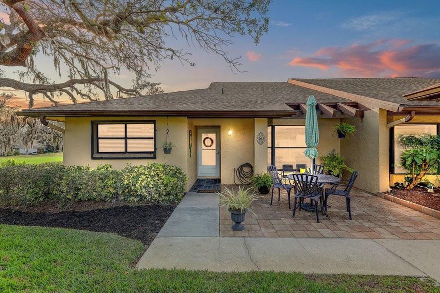 Welcome to 3454 Niblick Court, a beautifully maintained end-unit villa tucked away on a quiet cul-de-sac in the Seven Springs Golf & Country Club community. This inviting home offers a functional floor plan with comfortable living spaces designed for both everyday living and entertaining.

Step inside to a bright and open layout featuring spacious living and dining areas, neutral finishes, and abundant natural light throughout. The kitchen provides ample cabinet and counter space, making meal preparation easy while staying connected to the main living areas. Additional highlights include an eat-at-the-bar, updated features and appliances, and a large bay window that allows natural light to fill the home.

With 1,322 square feet, there is no shortage of space. The nicely sized primary suite offers a relaxing retreat with a custom walk-in closet and a private en-suite bath. The secondary bedroom is also well-sized and versatile—perfect for guests, a home office, or hobbies. A second full bathroom is conveniently located nearby for guest comfort. Enjoy peaceful golf course and water views from your private screened lanai or your air-conditioned Florida room.

This home has been thoughtfully updated and features wood-look porcelain tile throughout, protective exterior window screens, PGT windows, 5.25-inch baseboards, a water softener, and a hot water heater, along with a new washer and dryer located inside the unit.

Residents enjoy close proximity to the Seven Springs Golf & Country Club, offering an active lifestyle with two championship golf courses (additional fees apply), social events, and recreational amenities including tennis, pickleball, bocce ball, swimming pools, and a vibrant clubhouse atmosphere. The community is known for its welcoming social calendar and resort-style living, making it easy to stay active and connected year-round.

Conveniently located near shopping, dining, medical facilities, parks, airports, and Gulf beaches, this home offers both lifestyle and accessibility.

3454 Niblick Court is a fantastic opportunity to own a well-maintained home in a desirable New Port Richey location—without the high price tag. Don’t miss your chance to be part of this incredible community.