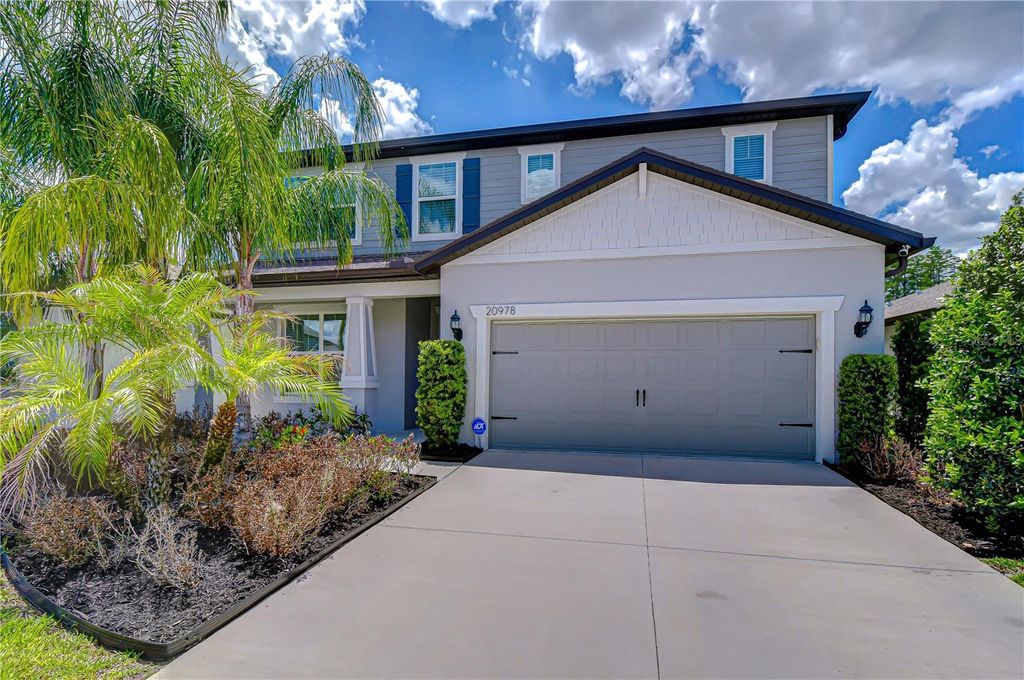 Photo of 20978 Monza Loop, Land O Lakes, FL 34638 (MLS # TB8500994)