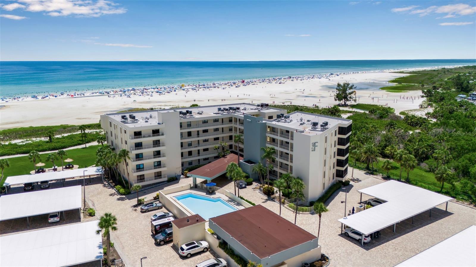 Welcome to Unit 405 in the highly sought-after Building F at Gulf & Bay Club, where breathtaking Gulf views and refined upgrades set the stage for an exceptional Siesta Key lifestyle. This spacious 2-bedroom, 2-bath residence showcases sweeping panoramas of the Gulf of Mexico, perfectly framed by hurricane-impact windows and sliding glass doors that fill the living spaces with natural light and coastal beauty. Inside, you’ll find thoughtful updates throughout, including a recently renovated primary bathroom and elegant porcelain tile floors that flow seamlessly from room to room.
The large kitchen is a standout feature, designed for both functionality and entertaining. It boasts granite countertops, abundant cabinet storage with custom drawers, a wine fridge, a double Dacor oven, two sinks, and a charming breakfast nook where you can enjoy your morning coffee. Just outside, Building F features its own clubhouse and a sparkling pool only steps from your door, offering both convenience and a touch of exclusivity to everyday living.
As a resident of Gulf & Bay Club, you’ll enjoy an unparalleled array of resort-style amenities on 32 acres of pristine, beautifully landscaped grounds. Spend your days lounging on 800 feet of private, powdery white sand, or take advantage of three heated pools, six tennis courts, six pickleball courts, a basketball court, a racquetball court, and a state-of-the-art fitness center complete with a yoga studio and dry saunas. Two clubhouses provide inviting spaces to gather, with lounges, a library, billiards, and Wi-Fi. Barbecue areas, picnic spots by freshwater lakes, and free EV charging stations make it easy to entertain and unwind. Just beyond the gates, you’re moments away from Siesta Key’s vibrant dining, shopping, and the iconic Sunday Drum Circle.
Combining spectacular views, meticulous upgrades, and the unmatched amenities of Gulf & Bay Club, Unit 405 offers a rare opportunity to embrace the very best of coastal living. This is more than a home—it’s a lifestyle you’ll treasure every day.