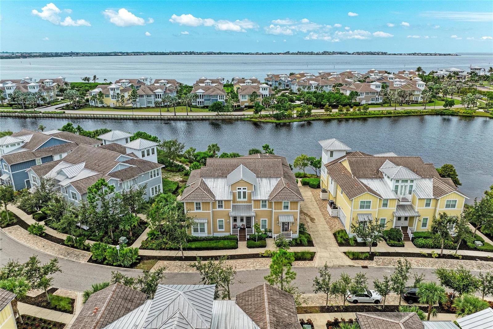 Welcome to your private oasis in Harbour Isle, a premier coastal resort community on Anna Maria Sound. This stunning Marsh Retreat home offers expansive water views of sparkling Sapphire Lake, inviting you to live every day like a vacation.
Start your mornings with a sunrise over the peaceful mangroves from your retreat and end them with a breathtaking sunset from your private, screened lanai. This is more than a home; it’s a tranquil sanctuary where nature’s beauty is a constant backdrop.
Inside, luxury and comfort merge seamlessly. Upgrades abound! The spacious living room features vaulted ceilings with elegant beams and French doors that open to the lanai, creating a perfect flow for entertaining. The gourmet kitchen is a chef's delight, complete with stainless steel appliances, double ovens, new sink, refinished kitchen cabinets, shiplap in kitchen and dining area and new quartz countertops.
The oversized owner’s suite provides fabulous lake views and a large walk-in closet, while the spa-like en-suite bath boasts dual granite vanities and a large rain shower. Two additional guest bedrooms offer generous space and privacy. Thoughtful details like tile flooring throughout, solid core doors, and a private elevator that opens directly into your living space elevate the home's appeal. An added bonus is the dedicated office space with dual built-in desks, perfect for working from home. Upgrades abound -- including new HVAC in 2025, all new light fixtures, new fans, new Quartz countertops in bathroom and hallway, new paint throughout the entire home, new shuttlers, shades and valences, new shiplap in ceiling of the great room and a new washer -- just to name a few. Life in Harbour Isle is unparalleled. Beyond your front door, explore two miles of scenic walking and biking trails, or head to the 23,000-square-foot Beach Club. Here, you can unwind at the heated resort-style pool and spa, toast the sunset at the Sky Bar lounge, or launch a kayak from the private beach. With four pools and the Mangrove Walk area—featuring grills and a fire pit—there’s a place for every mood.
Just outside the gates, enjoy the lively atmosphere of the Margaritaville-inspired Floridays Restaurant and Compass Hotel, or head a mile down the road to the sugar-sand beaches of Anna Maria Island. For the outdoor adventurer, Robinson Preserve is less than two miles away, offering miles of trails for walking, biking, and kayaking.
This is your chance to embrace paradise. Live, relax, and thrive in the award-winning community of Harbour Isle. For video copy and paste: https://vimeo.com/1118885878 to web browser.