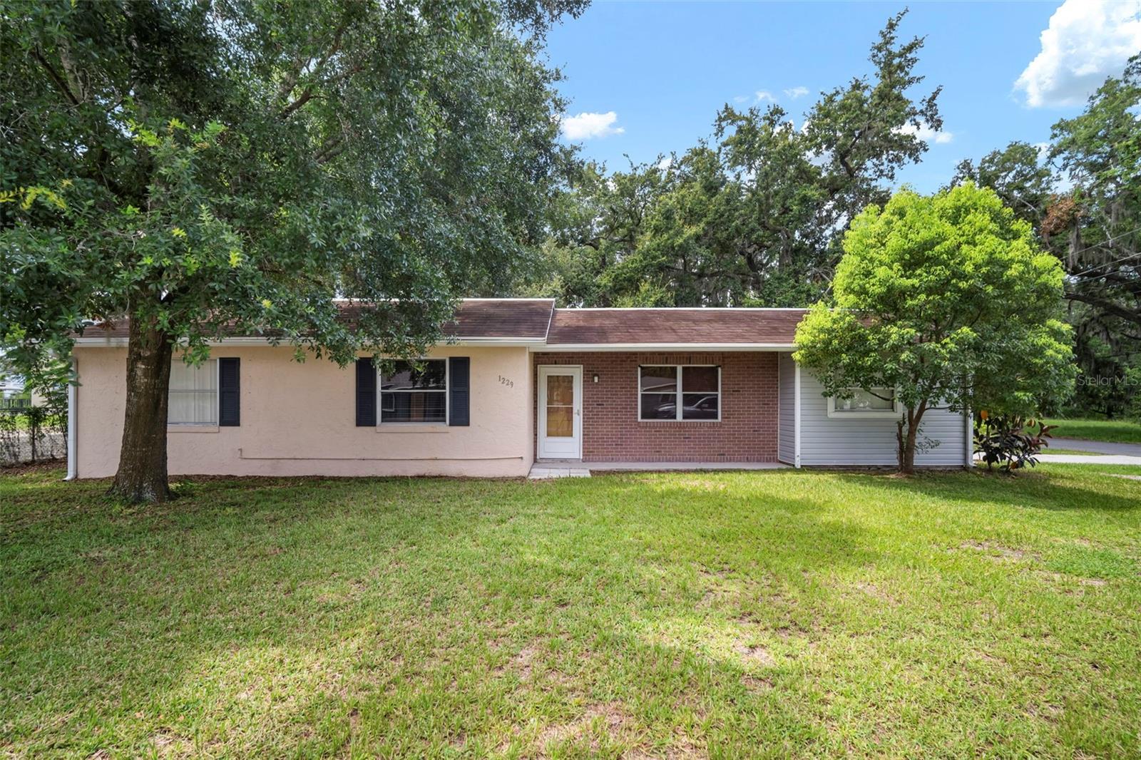 Charming ranch-style home ideal as a starter residence or investment opportunity. This spacious 4-bed, 2-bath floor plan features a bright galley kitchen with newer appliances and a dining area designed for storage and family meals. A generous great room welcomes you at entry while a separate family room offers flexible space for an office or additional bedroom.
The laundry room comes equipped with extra cabinetry, and updates include a newer AC, water heater, and modern flooring throughout the living spaces. The fully fenced yard and corner location provide privacy and curb appeal. No HOA or deed restrictions - bring your boat or RV! Minutes from the Strawberry Festival Grounds. See it today!