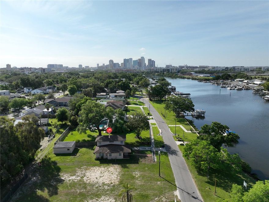 Opportunities like this are exceptionally rare. Nestled within the exclusive enclave of Ridgewood Park, this expansive ~9,000 sqft riverfront homesite represents one of the final chances to secure waterfront property just moments from Armature Works, the Riverwalk, and Downtown Tampa. Offered as a true blank canvas, this property invites the creation of a one-of-a-kind custom residence. With an impressive 140 feet of depth, the possibilities are endless—design a statement home complemented by a resort-style pool, detached casita, expansive garage, or private courtyard retreat tailored to your vision. What truly sets this offering apart is the included ~1,500 sqft parcel directly on the river, primed for a custom dock and/or boat lift—unlocking effortless access to Tampa’s waterways and delivering the ultimate Florida boating lifestyle. Riverside Drive has quickly transformed into one of Tampa’s most coveted waterfront corridors, lined with newly constructed homes ranging from $3M to $5M. Opportunities to join this prestigious stretch are becoming increasingly scarce. Walkability. Location. Serenity. Waterfront living. Exclusivity. All converge at 2515 N Riverside Dr—where your vision meets one of Tampa’s most compelling riverfront opportunities.