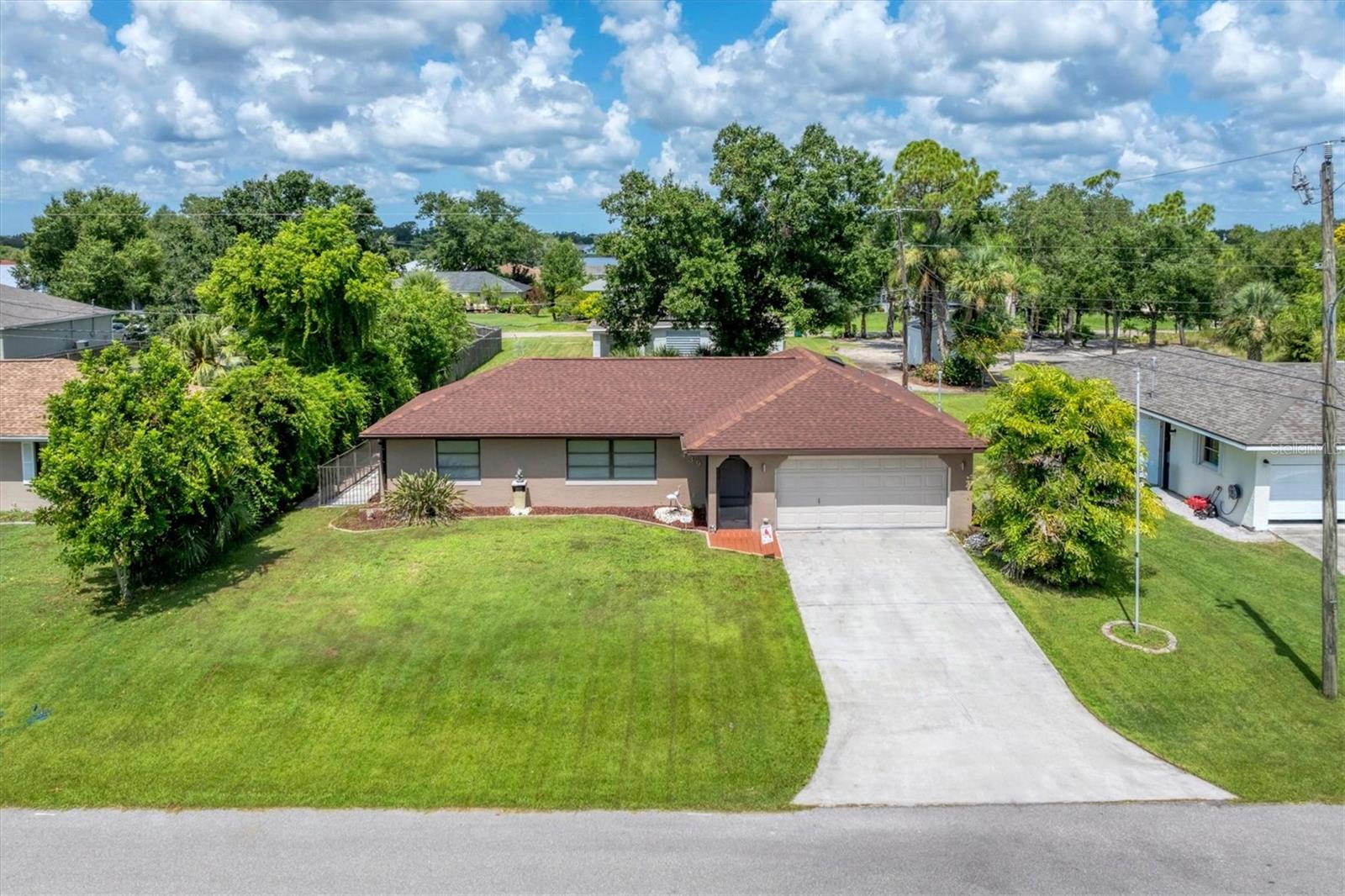Furnished and beautifully updated, this well-maintained 3-bedroom, 2-bath home is truly move-in ready! Recent upgrades include new lighting and ceiling fans in every room, plus luxury vinyl flooring in the main living areas. The kitchen shines with newer cabinets, sparkling granite countertops, and updated appliances. Enjoy the Florida lifestyle on the expansive 30' x 12' screened lanai, or unwind in the spacious sunroom featuring a full wall of sliders and peaceful backyard views. The 2-car garage offers screened panels and a new opener, while the side yard includes a fenced area—ideal for pets. Perfectly located just minutes from the heart of Port Charlotte, with shopping, medical facilities, and dining nearby, and only a short drive to charming Punta Gorda.