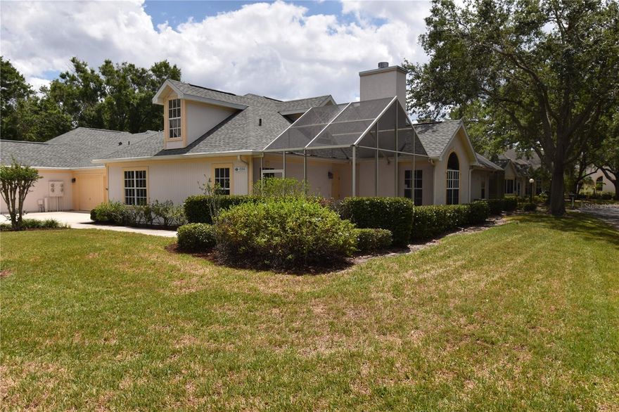 One or more photo(s) has been virtually staged. REDUCED TO SELL! MOTIVATED OWNERS, NO AGE RESTRICTIONS! RARELY AVAILABLE IN MAINTENANCE FREE CALUMET - ENDLESS POSSIBILITES!  2 BEDROOM 2.5 BATH with 2 CAR GARAGE on a key CORNER LOT with AMPLE GUEST PARKING.   LOW CONDO FEES!  Association maintains roof, lawn care and pest control.   Oak trees canopy the streets of this charming neighborhood of 66 homes. NEW ROOF in November 2021 and brand-new hot water heater 2023.   FIRST floor offers DOWNSTAIRS MASTER suite, Den, HALF BATH off of hallway, Inside Laundry, BRAND NEW CARPET, kitchen that opens to the dining and living room complete with wood burning fireplace... perfect for entertaining!  2nd bedroom suite located upstairs with walk in closet. Could also be used as office, playroom, art studio etc.  An oversized screened patio off the front door provides extended outdoor living area.  Great storage throughout the home and plenty of room in the 2 CAR GARAGE for projects!  Walking distance to the community heated pool overlooking the pond, clubhouse with full kitchen and fitness room.  This community is centrally located, with easy access to I 75.  Minutes away from shopping, restaurants, Parks, The Legacy Trail, Home Depot, hospitals and award-winning Siesta Beach!