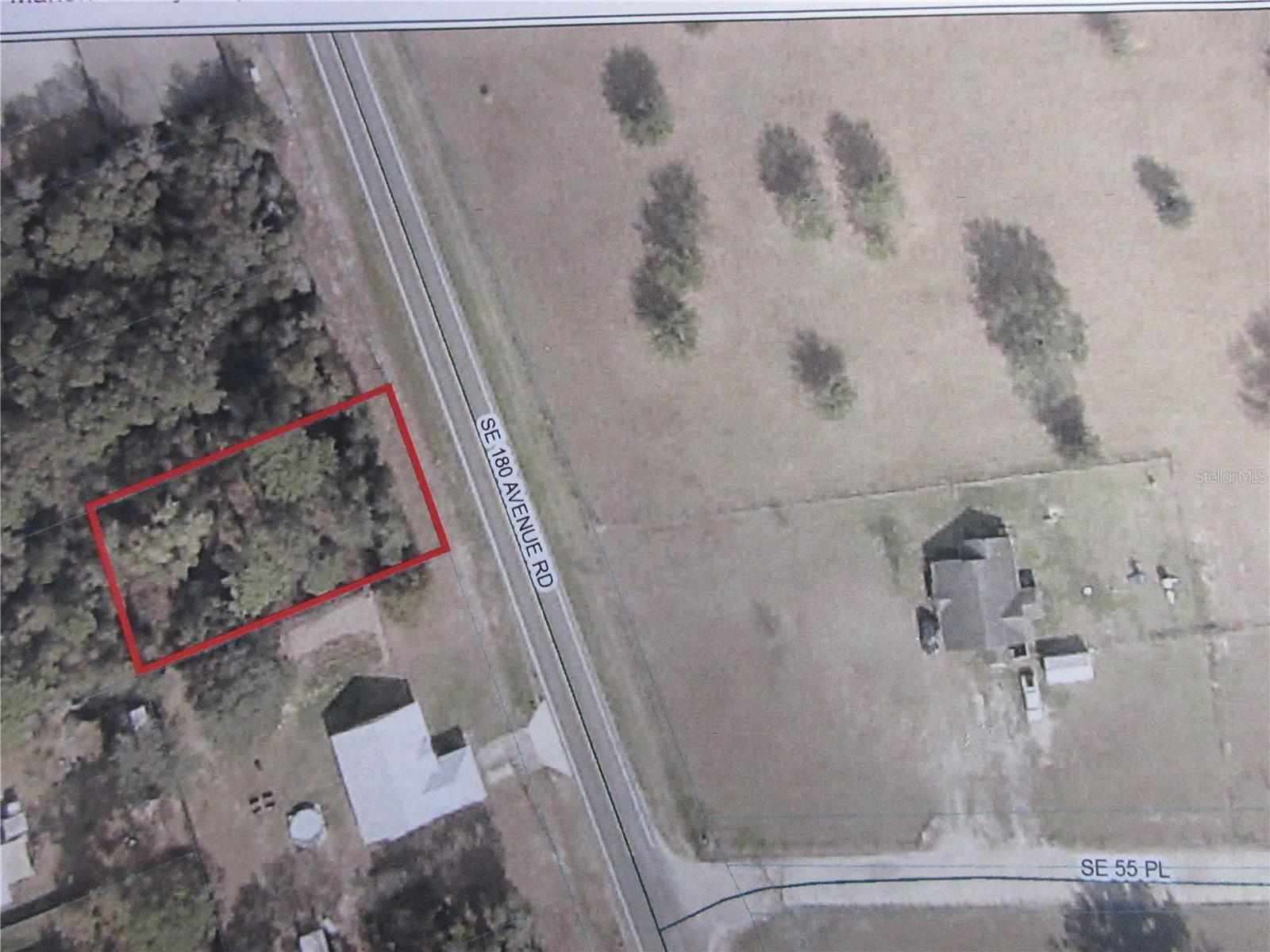 Come see this wooded .28 acre vacant lot in Ocklawaha, Florida! Perfect for building your new home. Zoned R-1 on a paved street road in a great neighborhood. Overlooking a beautiful farm across the street with gorgeous sunsets and partial lake views. Make an offer today!