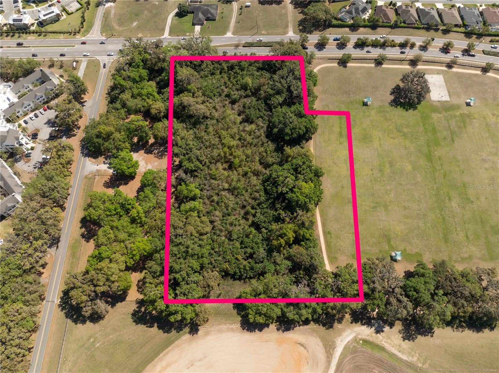 This prime 4.76-acre parcel, located just a stone's throw from The Villages' Brownwood Towncenter, represents one of the last remaining development sites on Powell Road. The property, consisting of two vacant land parcels totaling 207,338 square feet, offers an exceptional opportunity in one of Florida’s fastest-growing areas. Situated adjacent to the City of Wildwood’s Millennium Park, this site boasts direct access to essential community amenities while benefiting from the rapid expansion of The Villages—the largest and fastest-growing single-site development in the country.The property is zoned INS (Institutional), allowing for a range of institutional developments, such as public and private educational facilities, religious institutions, government buildings, cultural facilities, parks, recreational areas, and utilities. The City of Wildwood also may be open to rezoning for commercial retail uses, such as restaurants, further enhancing the property’s potential. Previously, the site had plans for a 95-unit assisted living and memory care facility and was rezoned to accommodate approximately 93 units, providing a solid foundation for future development.In addition, the property is one of the few available in the area with sewer capacity reservations, making it even more attractive for developers. A recent appraisal supports a value exceeding $2.2 million, but the owner has priced it aggressively for a quick sale. This exceptional location, combined with its zoning and proximity to The Villages, offers significant development potential. For more information, call or email today.