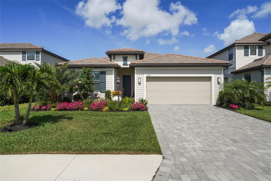 Welcome to the Florida lifestyle you've been waiting for. Built in 2023, this beautifully upgraded Marsala model in the sought-after gated community of Lorraine Lakes at Lakewood Ranch offers 3 bedrooms, 3 bathrooms, a private den with French doors, and the perfect blend of comfort, style, and resort-inspired living.

Inside, you'll find an open-concept design with tile flooring throughout the main living areas, plantation shutters, a custom electronic sunshade on the lanai slider, designer light fixtures, upgraded ceiling fans, quartz countertops, stainless steel appliances, under-cabinet lighting, natural gas cooking, and a built-in wine cooler ready for entertaining. The spacious owner's suite features custom-built closet shelving and a relaxing retreat at the end of the day.

Step outside to your private backyard oasis featuring a custom heated saltwater pool with sun shelf, bubbler, lighting package, large covered lanai, and lush tropical landscaping enhanced with mature Areca palms for added privacy. Western rear exposure creates the perfect setting for enjoying Florida's spectacular sunsets.

Additional upgrades include epoxy garage flooring, ceiling-mounted storage, an upgraded electrical panel, natural gas generator hookup, phantom screen entry door, hurricane shutters, and more.

Enjoy maintenance-friendly living with lawn care, irrigation, cable, internet, gated security, and access to Lorraine Lakes' exceptional amenity center featuring resort-style pools, fitness center, tennis, pickleball, indoor basketball, restaurant, bar, social events, and more. Conveniently located near Waterside Place, UTC shopping and dining, top-rated schools, and some of Florida's most beautiful Gulf Coast beaches.

Every day feels a little more like a vacation here.