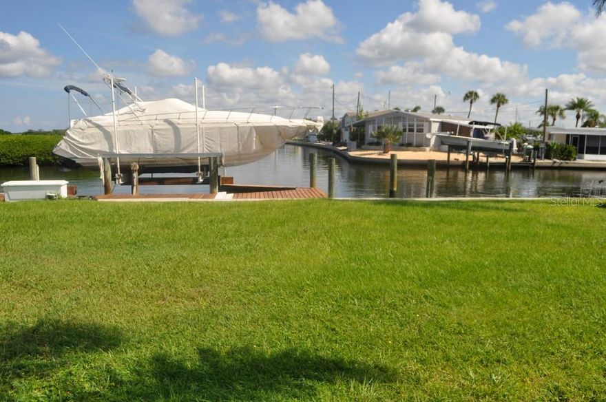 Waterfront Vacant Lot ready for your dream home! Waterfront lot with AMAZING VIEWS of Terra Ceia Bay! 55 FT of deep canal saltwater frontage. Seawall recently replaced and includes a 16,000 LB BOAT LIFT!  Direct access to Tampa bay, Gulf of Mexico, Egmont Key, Anna Maria Island and more! No bridges to navigate. Enjoy evening sunset views of birds and other wildlife. Fishermen will love catching snook, redfish, jacks, trout, and other game fish right from your own dock. Make an offer today before it is too late! Membership in the Yacht Club, clubhouse, swimming pool, spa, media room, pool room, and auditorium for $100 per year. 55+ community. Can be purchased with an additional 2 lots! See MLS #T2717392