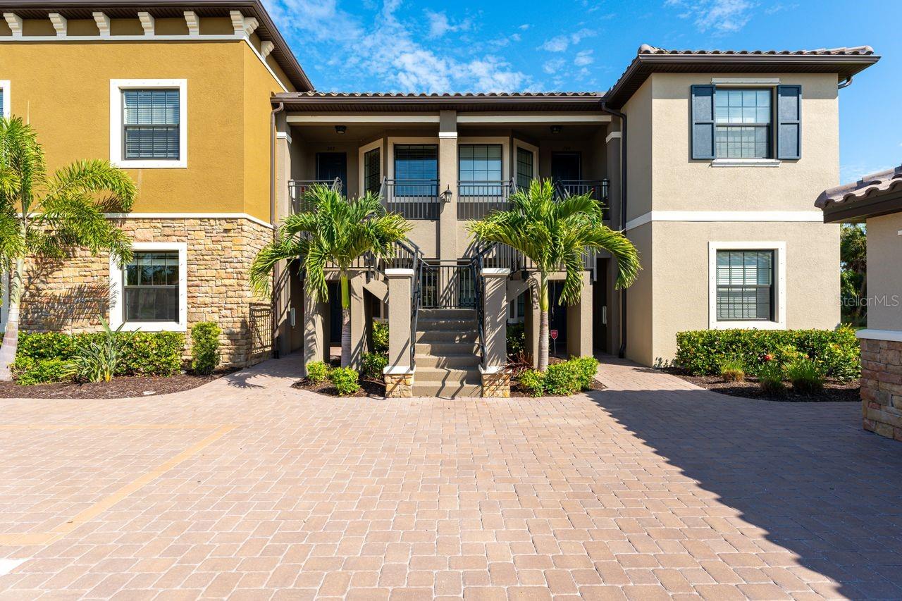 Experience Resort-Style Living in Esplanade on Palmer Ranch. Nestled in the highly sought-after community of Esplanade on Palmer Ranch, this beautifully designed ground-floor condo offers the perfect winter escape. With two spacious bedrooms, two bathrooms, and a den, this Garden Homes unit blends comfort with style. Step inside to find bright, neutral tile flooring throughout the main living areas, kitchen, and den, creating a seamless flow. The well-appointed kitchen features elegant granite countertops, stainless steel appliances, and thoughtful upgrades, including a custom-built banquette with storage, an extended kitchen counter with a wine fridge, plus an additional cabinet above the refrigerator for extra storage. This condo also comes with a detached one-car garage and an assigned parking spot. Hurricane panels are included for all windows and sliders, offering peace of mind in any weather. The community’s resort-style amenities are the real highlight. The amenity center is the heart of Esplanade, offering a full calendar of activities. Enjoy two sparkling pools, a splash area and playground, a fitness center, pickleball and tennis courts, spa services, and The Bahama Bar restaurant for casual dining. There’s truly something for everyone. For outdoor enthusiasts, the Legacy Trail is just minutes away, and Nokomis Beach is an easy 8-mile drive. Venice Beach is only 10 miles away, giving you endless options for sun, sand, and relaxation. Live where you vacation – come and see this exceptional property today!