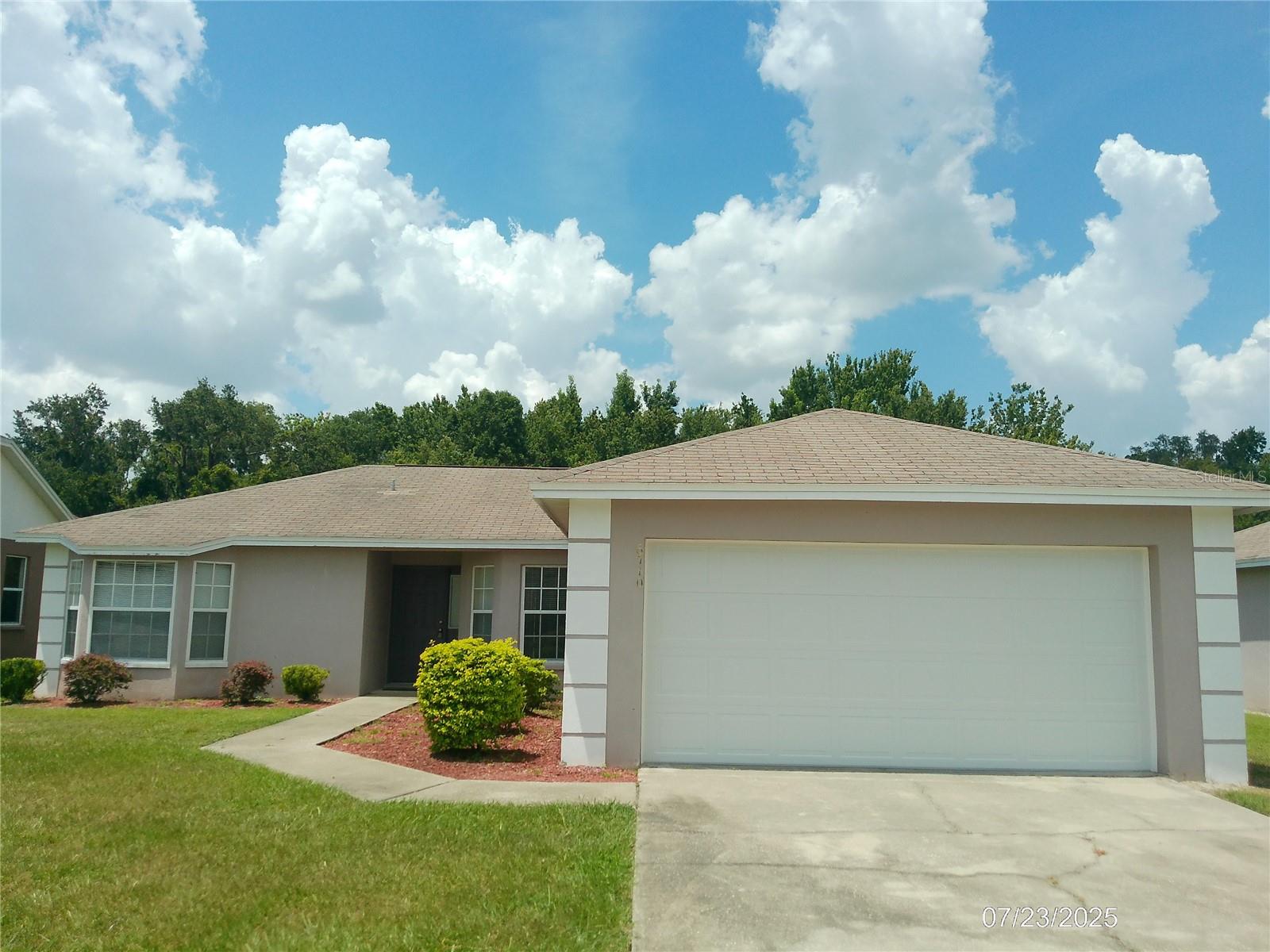 BEAUTIFUL 3 BEDROOM 2 BATH, LAWN SERVICE INCLUDED. This beautiful home. Past the home is a thicket of Florida scrub and trees, providing a gorgeous place to relax and de-stress at home. The home features a two-car garage, separate laundry room that connects to the kitchen. The kitchen has a breakfast bar, appliances, and a breakfast nook that sits before a set of bay windows. The kitchen opens up to a living room with a sliding glass door to the back yard. To the right is the master bedroom and bath, with 1 carpeted walk-in closets and a regular closet, master has a shower no tub. Returning to the living room the left hall leads to the remaining two bedrooms and the final bathroom. One-bedroom features bay windows that allow golden sunlight to filter in in the afternoon casting the room in a warm glow. Lawn service is included in the rent. This home is an absolute gem and will not last long! NO PETS, service animals an exception of course.