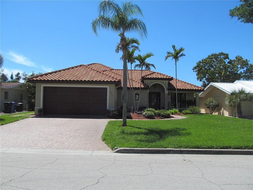 ISLAND OF VENICE! Location, Location, Location  This lovely home is located across the street from beautiful West Blalock Park.  Designer Coviello and Associates worked with Hutchinson Construction to complete this masterpiece in late December 2013.  Pride of ownership shows as the original owners have provided exceptionally care. Impressive entry, soaring ceilings and indoor and outdoor living blend seamlessly. For the culinary inclined, the kitchen has just been redone. This kitchen was designed for hosting, celebrating, or just lingering.  The refrigerator, microwave oven, traditional oven, dishwasher, washer and dryer have been replace in March 2026.  The gas cook top, the water heater, outdoor grill and whole house Generac generator are fueled  from a 250 gal propane tank.  The primary bedroom suite is a peaceful retreat and is located on the first floor, as well as the great room and studio. The second floor has a fabulous private guest room with luxury bath.  The garage is a whapping 852 sq ft.  The screen lanai is 16 ft X10 ft, and is accessible from the great room and the primary suite. The library, events at the community center, The triangle Inn, Old Betsy (1925 firetruck) and the arts center are just steps away. Charm, comfort, and convenience awaits you in this fabulous Venice home. Walking trails, bike trails, festivals, art fairs, local theater, the beach, boating and dining are all easy to reach.  Come on down to the Island of Venice.  We can't wait to met you.