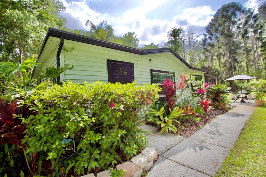 SIMPLE LIVING WITH THE LUXURY OF ALMOST AN ACRE OF PRIVACY!!!! If you are a snowbird and  you want a quaint home to visit when you come to Florida and Park your RV or if you are a resident and want acreage to park your boats, trailers, cars, or just need space...this is the property for you! This home offers you the privacy to feel like you are living off the grid while at the same time have an incredible location near the heart of Tampa...look no more! As you enter this property you are welcomed by the charm and simplicity of what this home offers. You can add more structures, expand the footprint of the home, or maybe a greenhouse with a chicken coup! This 2 bed 1 bath remodeled home is situated on almost an acre of completely private land and comes complete with an RV storage carport and a custom fire pit! The owners have updated this original Florida style home with modern finishes while keeping the charm of old Florida! You will not find a better location so make your appointment today!