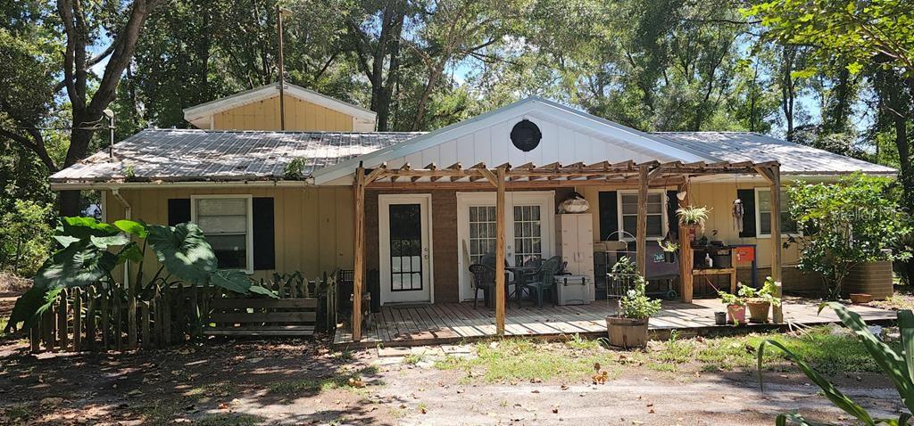 This spacious and secluded home sits on a lovely 1.38 acres and is completely fenced. With 5 bedrooms, 4 bathrooms, and an open kitchen, there is no reason to feel crowded. A large workshop with electricity conveys with the property. If you enjoy playing golf, Chiefland Golf Course is only 4 minutes from this great property. The beautiful Manatee Springs State Park, and the Suwannee River are just 7 minutes away. Chiefland is also about 7 minutes away, and offers a variety of restaurants, shopping, medical offices, churches, and many other businesses. Chiefland's pre-k, k-12 public schools, private and charter schools, as well as a Central Florida Community College Campus, are all conveniently located and just minutes away. There really is something for everyone in this great community. The price is right for the size of this home on a fully fenced acre. Call me today for your personal tour.