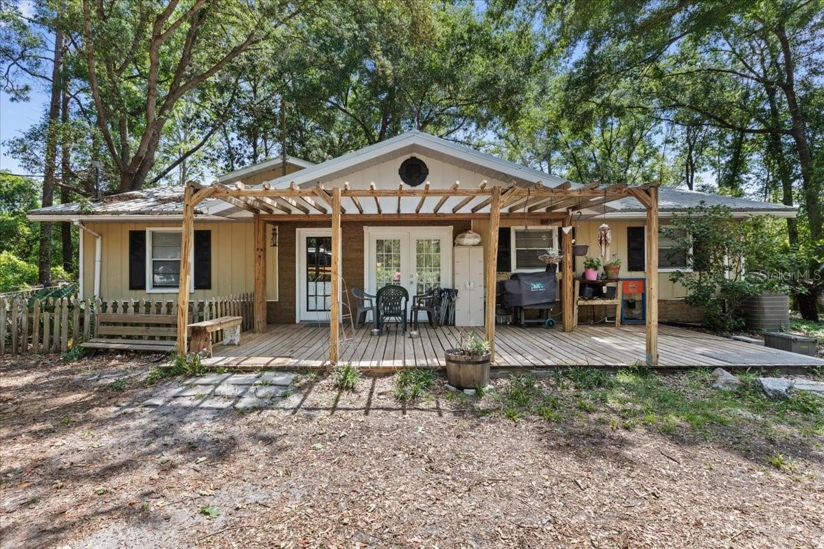 This spacious and secluded home sits on a lovely 1.38 acres and is completely fenced. With 5 bedrooms, 4 bathrooms, and an open kitchen, there is no reason to feel crowded. A large workshop with electricity conveys with the property. If you enjoy playing golf, Chiefland Golf Course is only 4 minutes from this great property. The beautiful Manatee Springs State Park, and the Suwannee River are just 7 minutes away. Chiefland is also about 7 minutes away, and offers a variety of restaurants, shopping, medical offices, churches, and many other businesses. Chiefland's pre-k, k-12 public schools, private and charter schools, as well as a Central Florida Community College Campus, are all conveniently located and just minutes away. There really is something for everyone in this great community. The price is right for the size of this home on a fully fenced acre. Call me today for your personal tour.