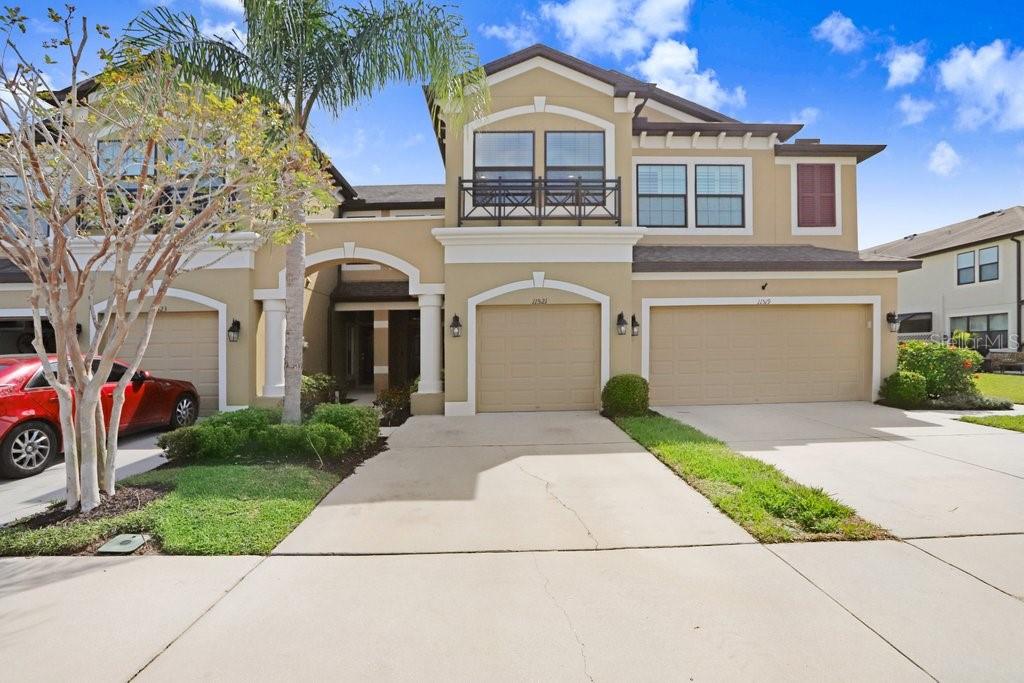 FABULOUS Rental Available in West Lake Townhomes, an exclusive gated community in the heart of Westchase. This exquisite two-story townhome boasts 3 bedrooms, 2.5 bathrooms, a private porch, and breathtaking pond views. As you step inside, you'll immediately be greeted by a spacious floor plan. The expansive great room features elegant wood-look tile flooring and seamlessly flows into the dining area and an incredible open kitchen. The stylish kitchen showcases beautiful white cabinetry, two decorative glass-front cabinets, stainless steel GE appliances, and a deep, single-well sink that overlooks the sparkling pond. Right off the kitchen, access your private porch, which steps out into a quaint yard offering serene water views. Upstairs, you'll find your primary suite retreat, complete with more stunning pond views, a large walk-in closet with custom-built storage systems, and a versatile en-suite bathroom. The en-suite features a marble-top dual vanity, a large walk-in shower, and a private water closet. Additionally, the second floor hosts two well-sized bedrooms located near the front of the home—one featuring plush carpet and the other with wood-look tile flooring—sharing a spacious full bathroom. The large laundry room, conveniently located upstairs, offers plenty of storage space. Washer/Dryer stay with the home. Water/Sewer/Trash included in the rent! The one-car garage provides additional storage space, ensuring you have plenty of room to keep your belongings organized. Guest parking is conveniently available throughout the community. Maintenance free living with Water/Sewer included! West Lake Townhomes also includes a pool and is close to grocery stores, restaurants, Citrus Park Mall, golf courses, and offers quick access to the Veteran's Expressway and airport. Experience the perfect blend of luxury, comfort, and natural beauty in this exceptional townhome at West Lake Townhomes.
