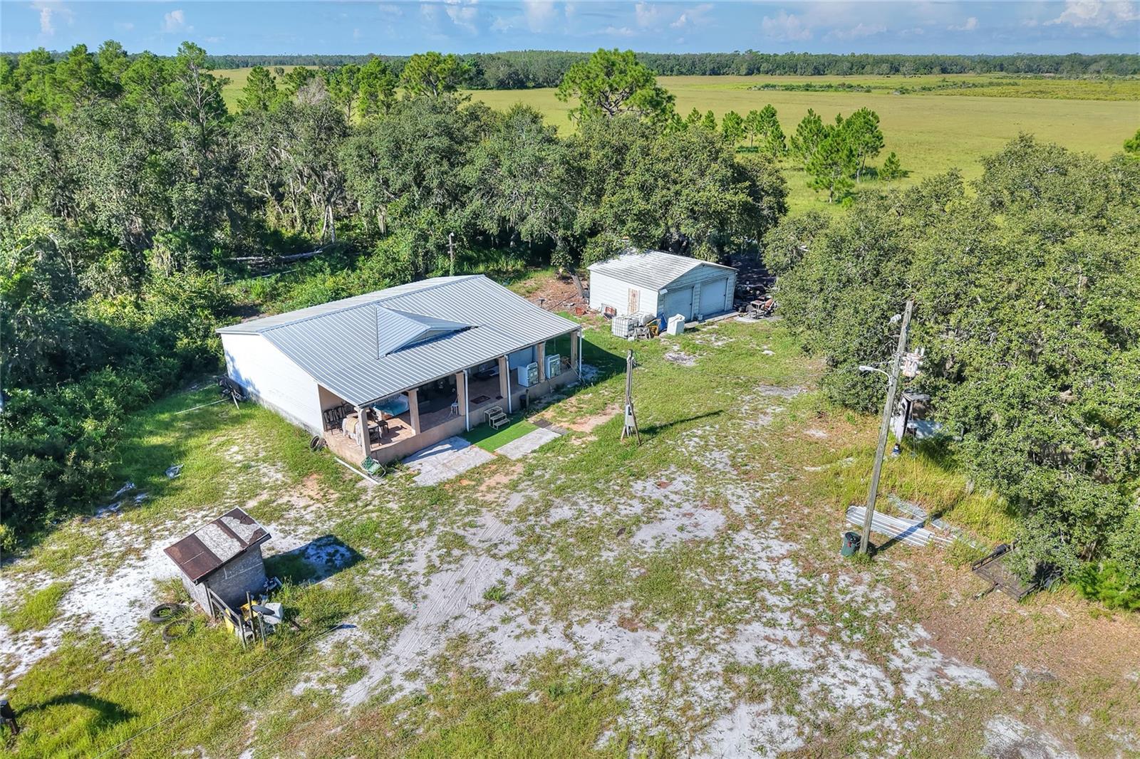 This home is USDA approved, no down payment required!!!!! Escape the hustle and bustle of city life and enjoy peaceful country living on this picturesque 3.66-acre property in Frostproof. Whether looking for a move-in-ready home or a place to remodel and make your own, this property has everything. Enjoy your morning coffee on the spacious front porch with a view of wide-open spaces, fresh air, and a lifestyle that embraces simplicity and serenity. The home can be sold fully furnished, and yes, even the chickens are included. So bring your horse and don't miss this opportunity to enjoy the homestead lifestyle.