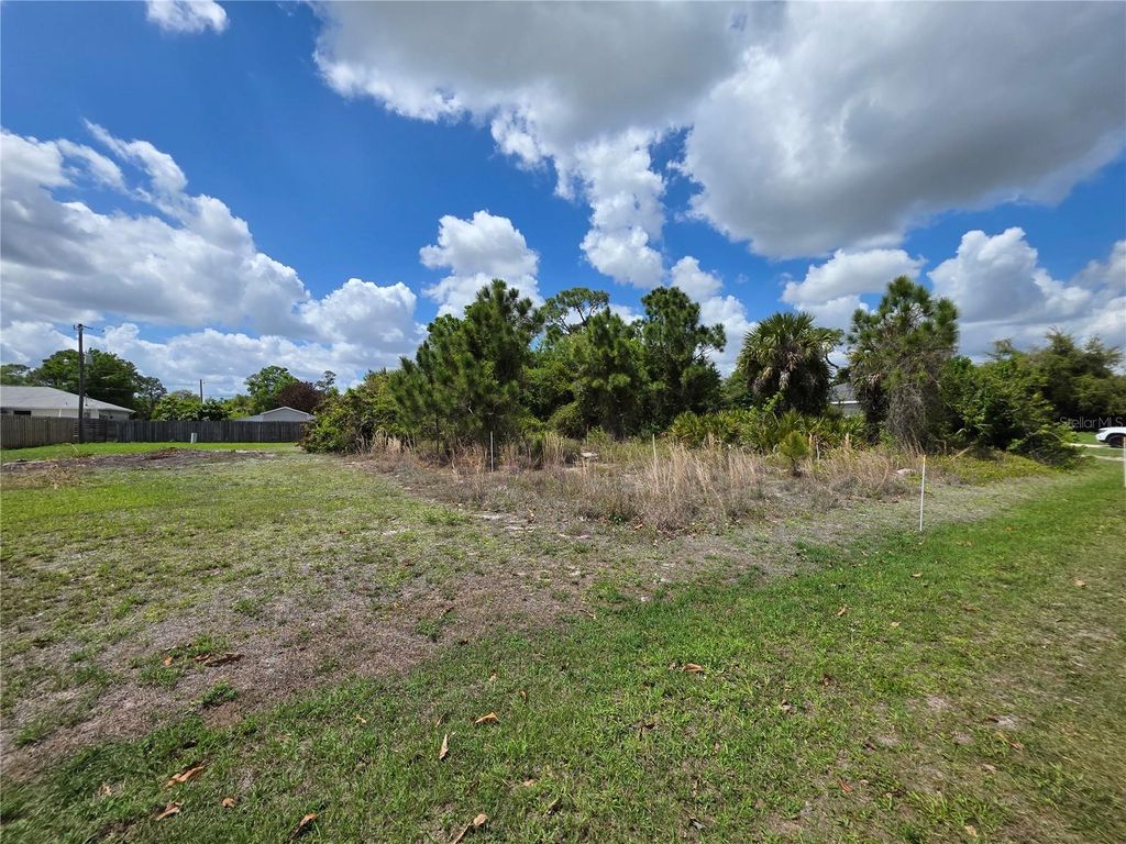 Photo of 215 Fletcher Street, Port Charlotte, FL 33954 (MLS # O6396179)