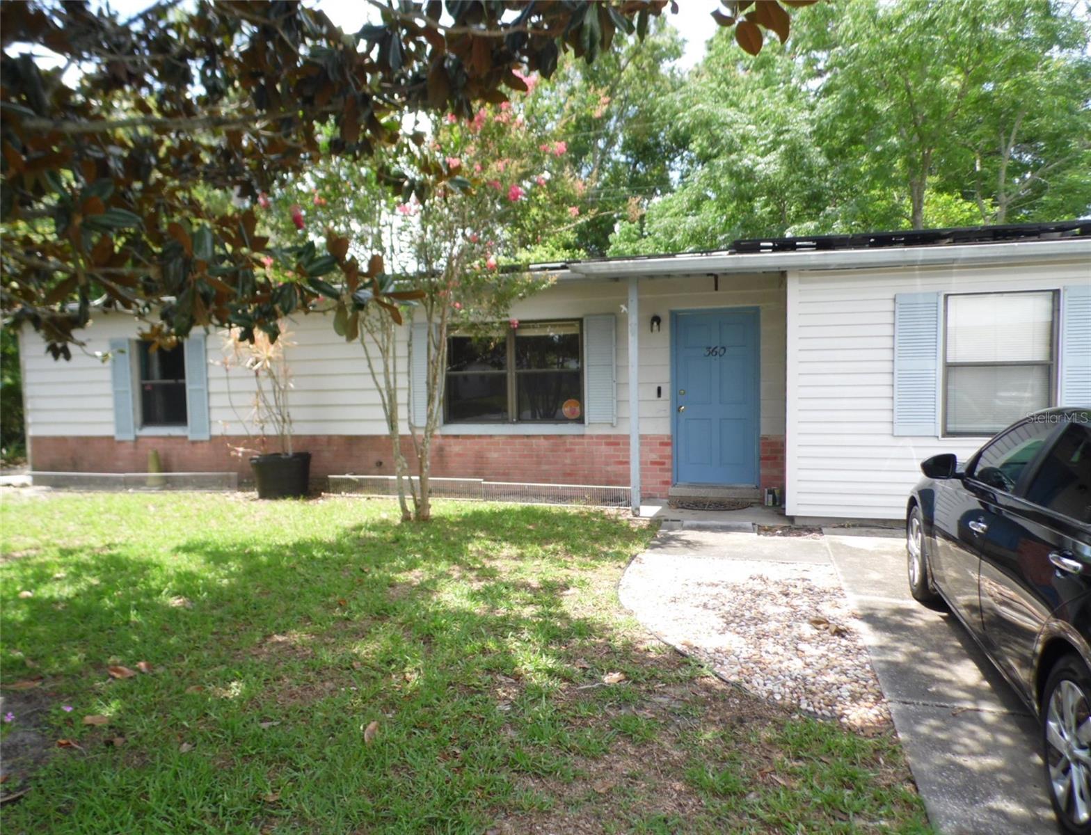 PRICE JUST REDUCED!!!! LOCATION, LOCATION, LOCATION! Close to shopping and restaurants. Very nice large corner lot with wonderful landscaping! Property has been owned and very well maintained by the same owner for the past 30+ years. Owned solar panels keep electric power bills very low. Beautiful walk-in tub/shower recently installed in master bathroom. New carpet installed throughout. Wonderful cedarwood family room complete with fireplace and a brick hearth! Very nice kitchen appliances included. Newer electric hot water heater. Digital security system installed with external cameras. This property comes with two large storage sheds in the back yard.