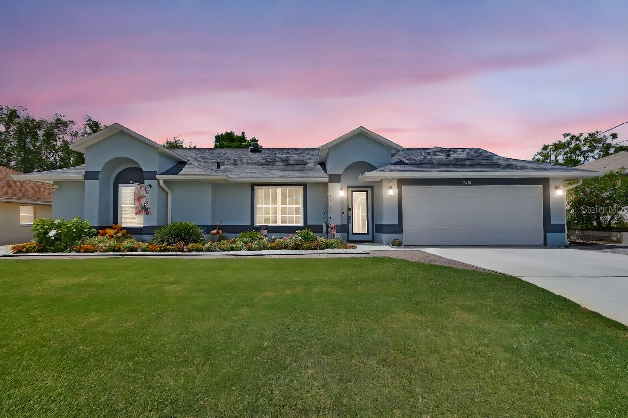 Every detail of this energy efficient 4-bedroom 2-bath pool home with an amazing backyard has been considered. Upon entering the meticulously kept and beautifully landscaped home with NO HOA, the tall ceilings, ornate wall decor and gorgeous hardwood floors that adorn much of this gorgeous home command your attention. The beautiful kitchen boasts 42” custom wood cabinets with lifetime warranty, a gas side by side double oven, a Fisher Paykel double dishwasher, custom-tile backsplash, a large pantry, an abundance of natural lighting, and beautiful views through the large windows that overlook the backyard pool oasis. The 19’ X 12’ Primary Bedroom Suite features cathedral ceilings, crown molding, hardwood floors, decorative chair rail, a huge walk-in closet and is adjacent to the ensuite bath with custom-tiled walk-in shower, a luxurious steam shower, and dual sinks with upgraded fixtures. The 15 KW solar panels are completely PAID OFF and the newer hybrid water heater and updated windows with lifetime warranty are ultra energy efficient, so the electric bills are around $30/month. But…the BEST is yet to come!!! This backyard oasis is amazing! The decorative non-slip rubber surfacing surrounds this huge swimming pool as sounds of the birds and waterfall into the gorgeous Koi pond surround you. The lush landscaping and fairy garden makes this backyard oasis special, whether you’re lying or splashing in the cool waters of the swimming pool, relaxing under the cool shade of the arbor, or enjoying a cool evening by the warm fire in the fire pit on the beach-sand, this home is for those seeking a truly special, natural experience. Additional features include an additional driveway including behind-the face of the home parking for your work truck, RV or boat, Celebration Bermuda grass, front and rear exterior lighting, keyless entry, camera system, and the 3rd bedroom is set up as an office space. The roof, gutters, and facia were all new in 2021, the variable speed pool pump and filter were new in 2020, the 5-ton, 18 seer AC system and hybrid water heater are newer, and the septic tank was pumped just two years ago. The water softener, all appliances, including the washer and dryer and the upright freezer in the garage stay with your new home. Located just a short ride from the Amazon Distribution Center, UF Health and I-4, this home is perfectly located near everything you want or need. Ask for the unbranded virtual walking tour of this home. All measurements are approximate and should be independently verified.