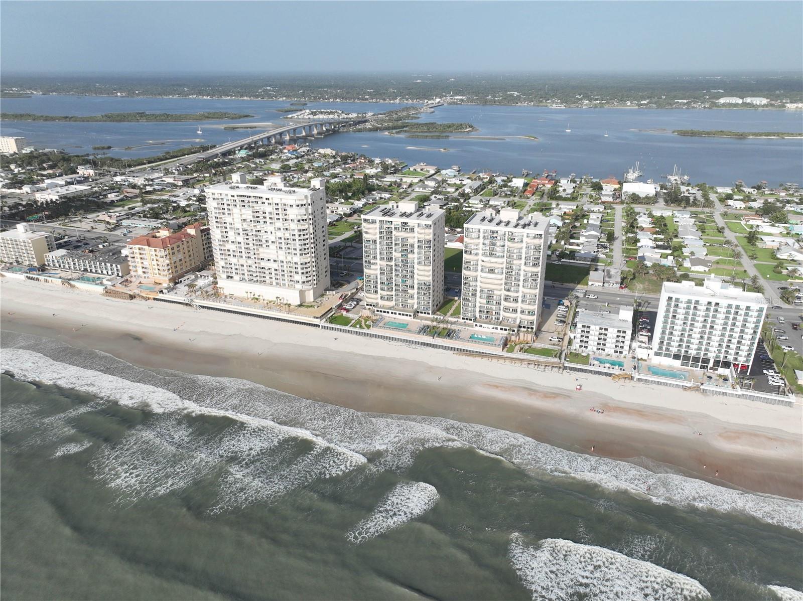 Direct, luxury, oceanfront living at its' finest. Direct views from the eighth floor overlooking the Atlantic Ocean and the huge stretch of beach. Enjoy this spacious, 3/3 condo with an extra size bonus room for living, reading, library or study. Two, bedroom suites on either side of the living room enjoy ocean views and access to the expansive balcony. A spacious kitchen with dining area is perfect for creating amazing meals or entertaining. Amenities include pool, beach access, fitness and a large, social meeting room for meeting friends, neighbors and enjoyable community gatherings. Underground parking for your vehicle. This contemporary styled building is located on the main strip along the ocean and offers easy access to the Dunlawton Avenue Bridge which takes you across the beautiful ICW and into Port Orange for more shopping, dining and service options. Easy access to US1, I-95, I-4 to Orlando. Elevator is in the main lobby to access all floors. Onsite Property Management office on the main floor.
